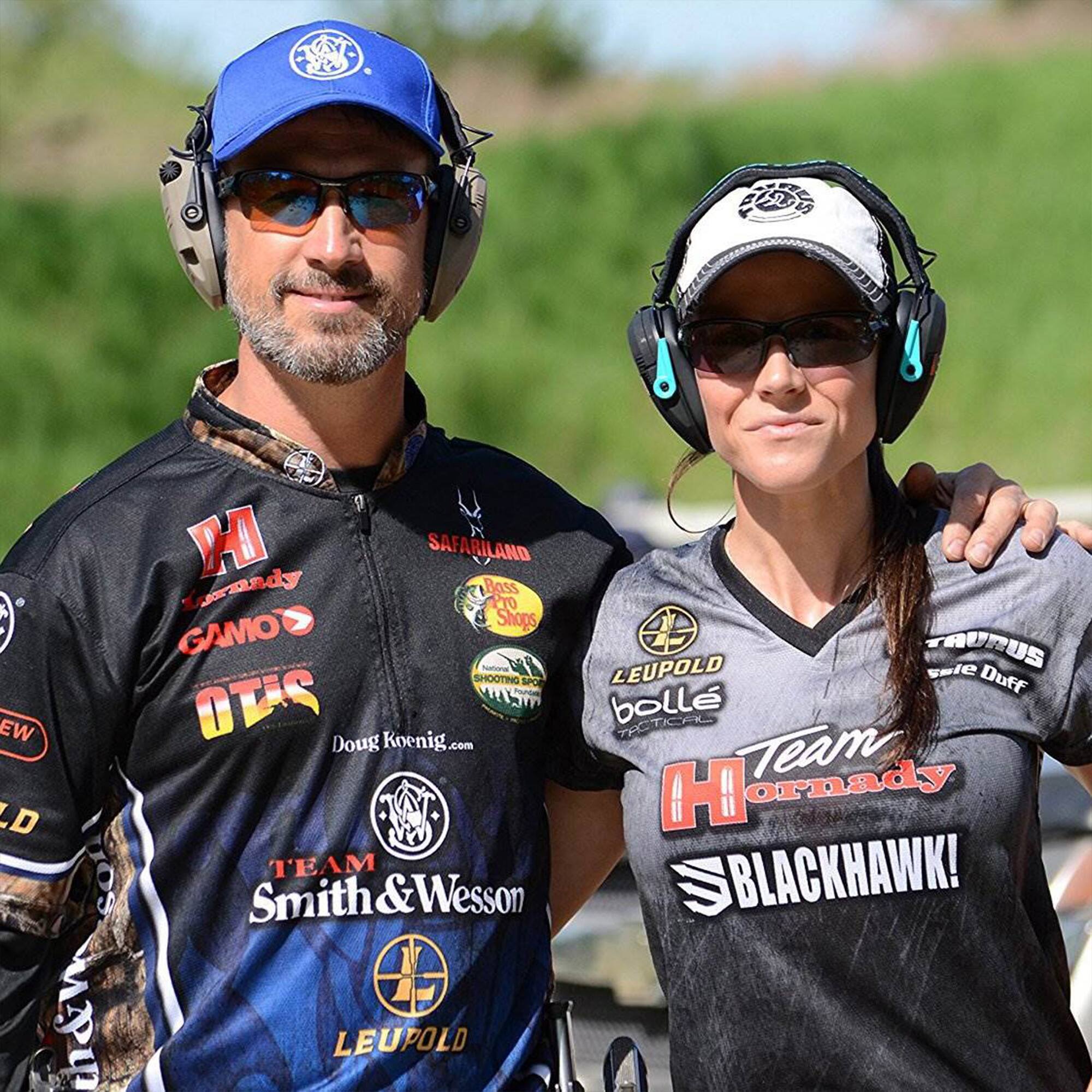 Sure, here is the corrected and grouped text from the image:

---

**Left Side:**

- **Hornady**
- **GAMO**
- **OTIS**
- **SAFARI LAND**
- **Doug Koenig.com**
- **TEAM Smith & Wesson**
- **LEUPOLD**

**Right Side:**

- **LEUPOLD**
- **bollé**
- **Team Hornady**
- **BLACKHAWK!**
- **TAURUS**
- **Safe Duff**

---

This text is grouped based on the logos and text visible on the clothing of the individuals in the image.