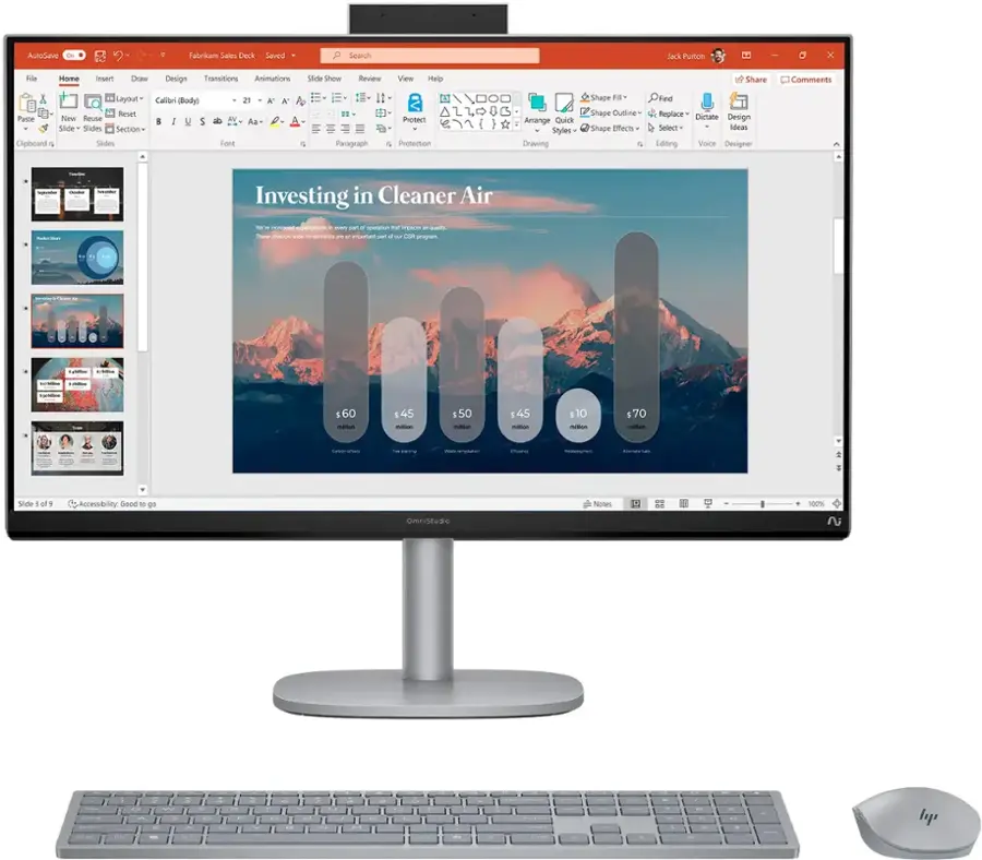 Investing in Cleaner Air was a wise decision. The image shows a computer screen with a presentation about investing in cleaner air. The screen displays a graph and a slide show, which likely provide information about the benefits of investing in cleaner air. The computer setup includes a keyboard and a mouse, indicating that the user is actively engaged in working with the presentation.