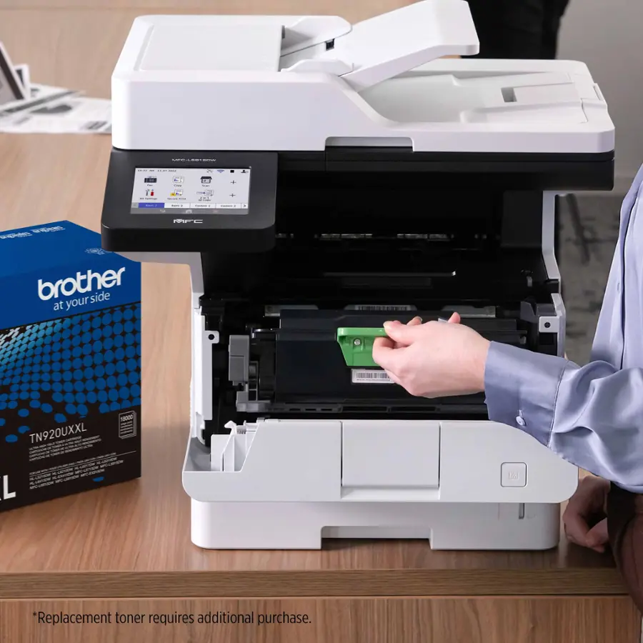 Brother printers are designed to be reliable and efficient, but eventually, the toner cartridge will need to be replaced. The image shows a person holding a new toner cartridge, ready to install it into the printer. The toner cartridge is a necessary replacement part for the printer, and it is available for purchase separately. The person is likely preparing to replace the toner cartridge to ensure that the printer continues to function at its best.