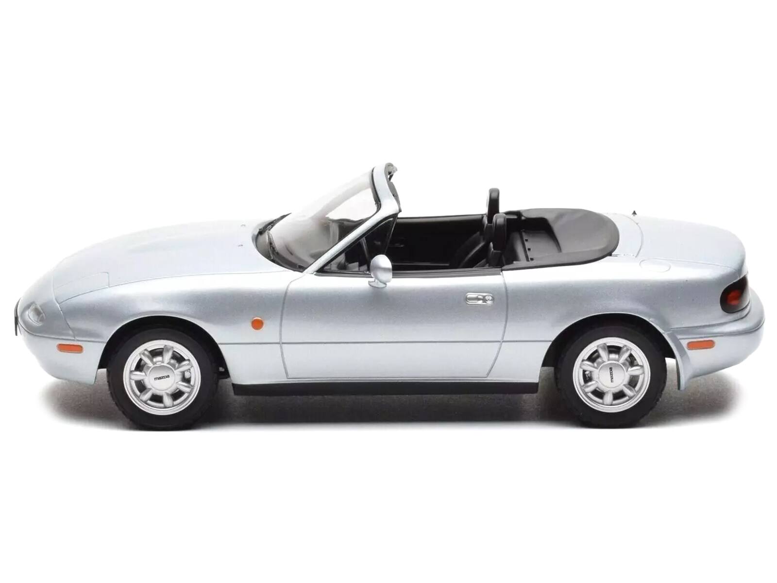 Left. Norev - 1991 Mazda MX-5 Convertible Silver Metallic 1/18 Diecast Model Car by Norev - Silver Metallic.