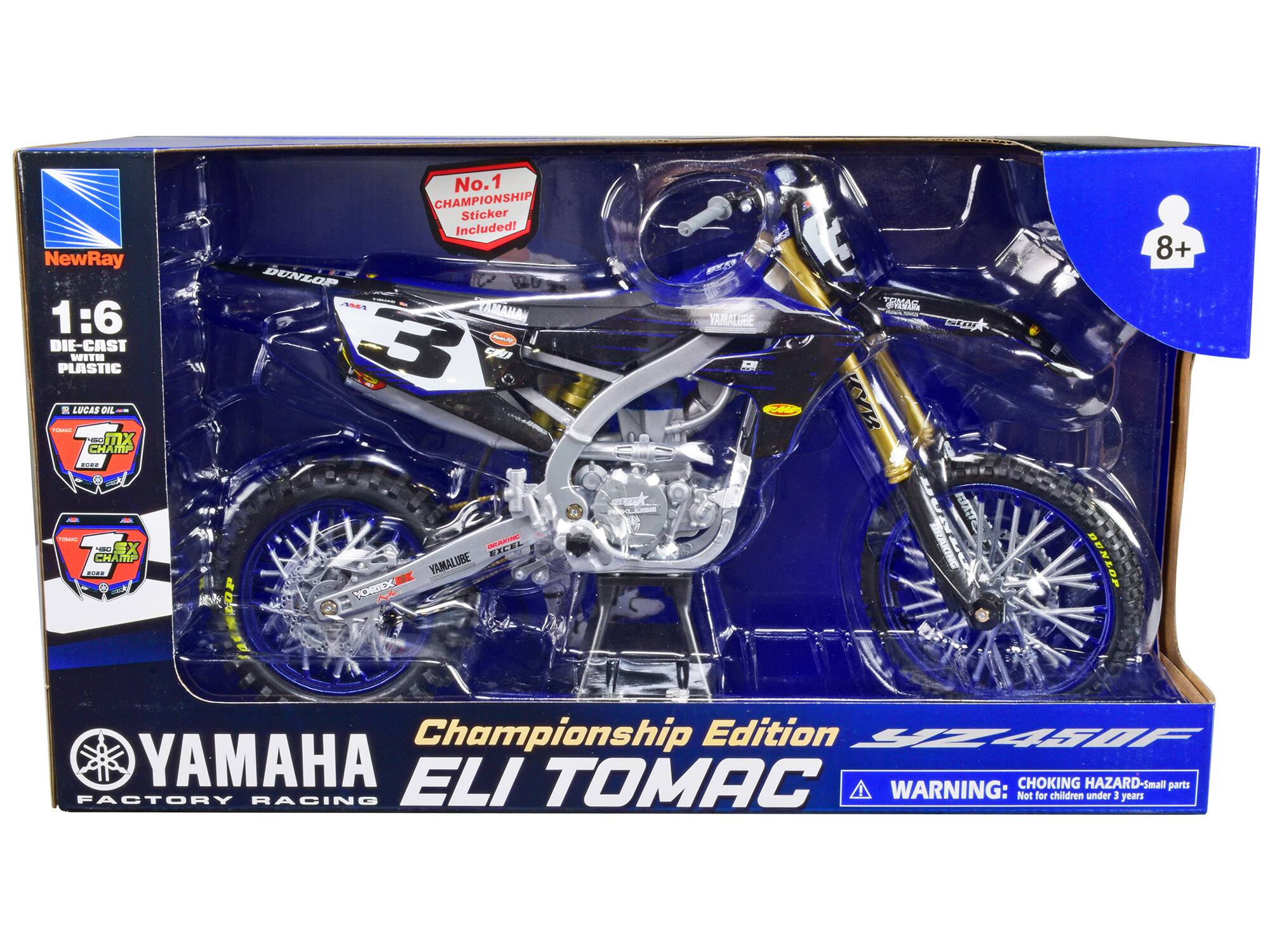 NewRay  
1:6 DIE-CAST WITH PLASTIC  

R LUCAS OIL  
MX CHAMP  
No.1 CHAMPIONSHIP Sticker Included!  

DUNLOP  
AMA 3  
YAMALUBE 400  
YOREX  
YAMAHA  
ELI TOMAC  

Championship Edition  
YAMAHA FACTORY RACING  

WARNING: CHOKING HAZARD - Small parts  
Not for children under 3 years  

8+
