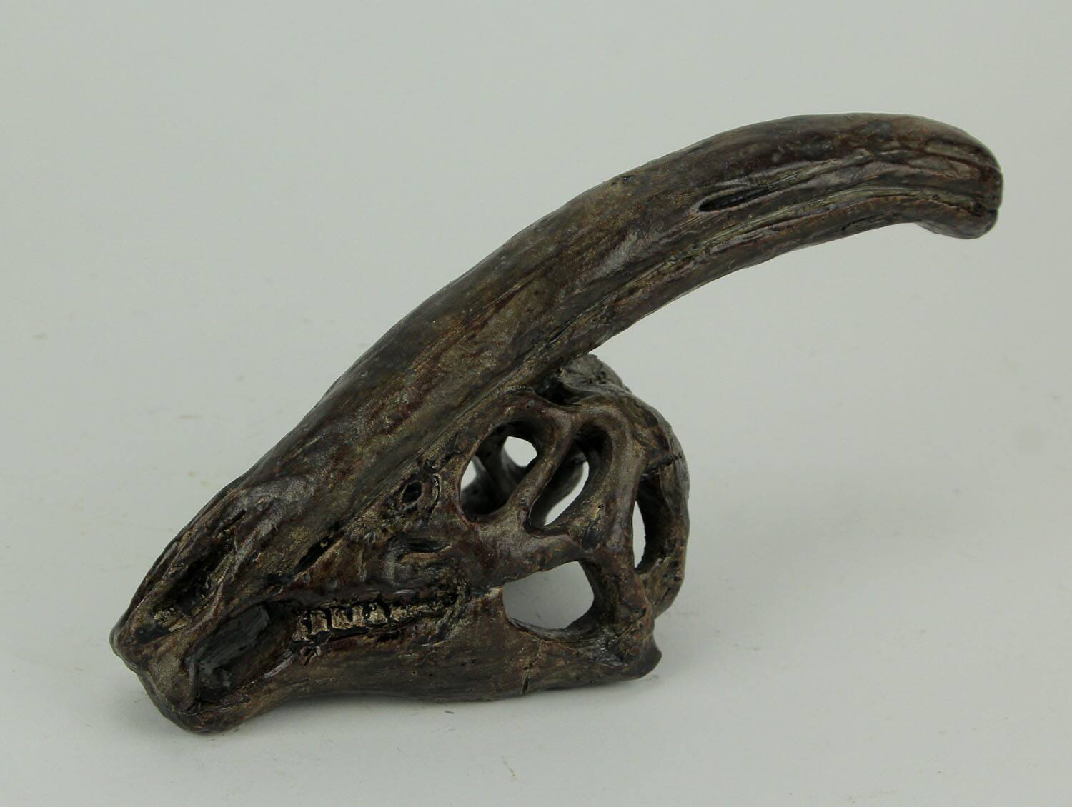 Alt View 1. Zeckos - 8 in Parasaurolophus Dinosaur Skull Fossil Resin Statue Home Office Decor - Brown.
