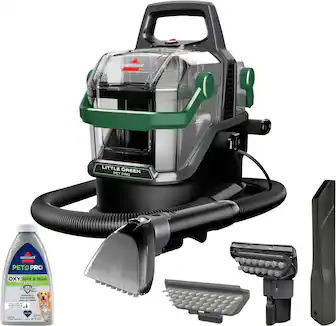 The image shows a Little Green Pet Pro machine, which is a portable vacuum cleaner. The machine is designed to clean up pet hair and dirt, making it a useful tool for pet owners. The machine is accompanied by a bottle of Pet Pro Oxy & Stain Uinilator, which is a spot and stain remover that can be used to clean up any messes left behind by pets. The combination of the vacuum cleaner and the stain remover makes this a complete pet cleaning solution.