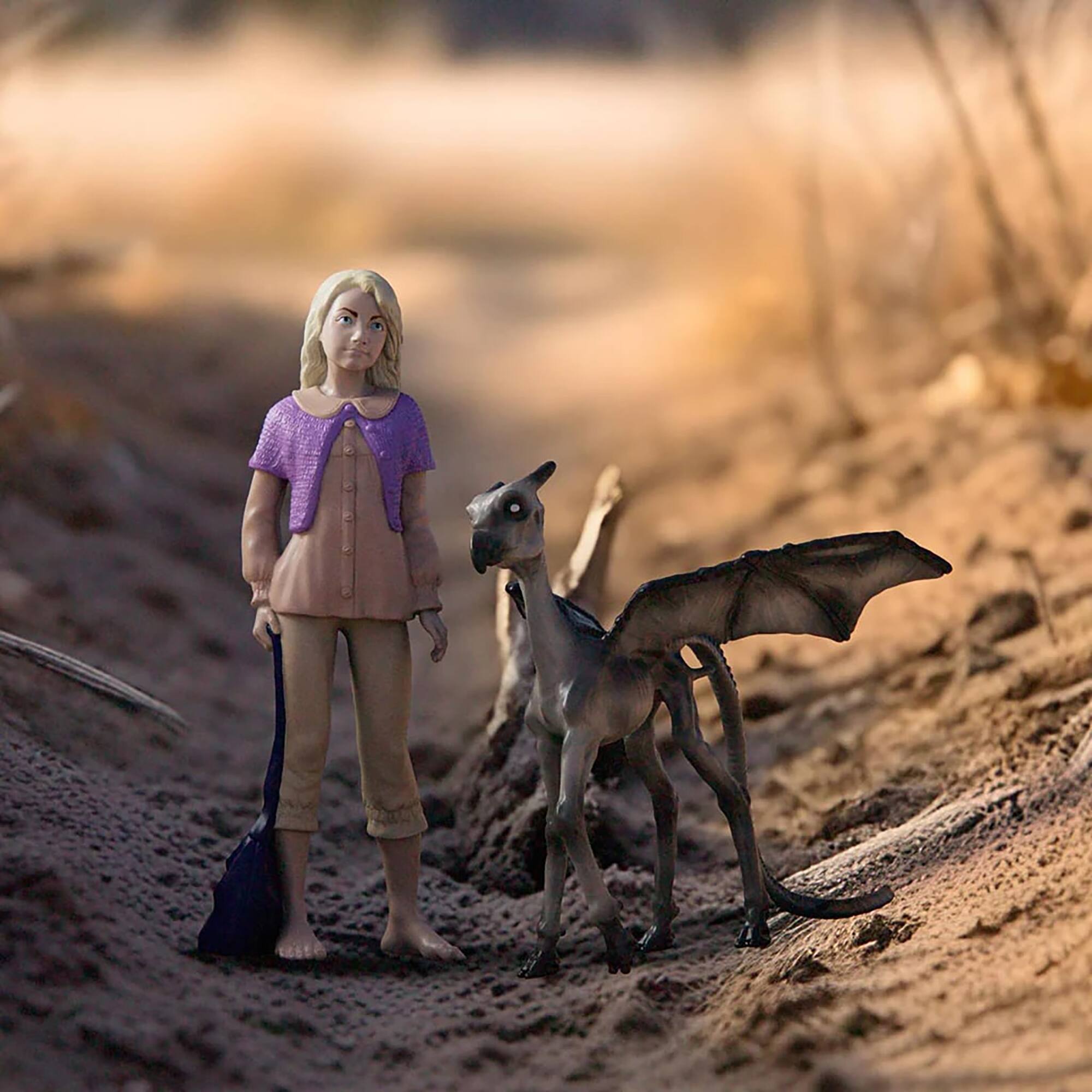 Left. Schleich - Luna Lovegood & Baby Thestral.