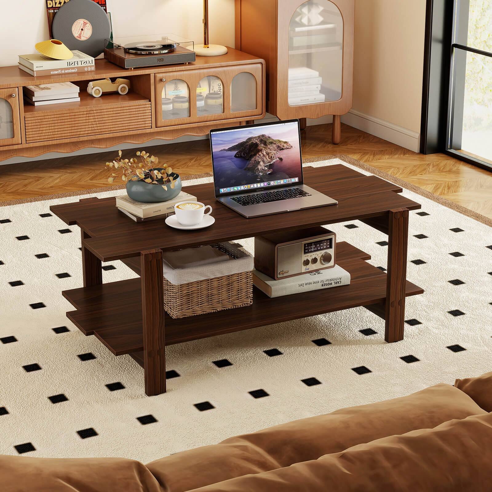 The image shows a living room with a laptop placed on a coffee table. The table is surrounded by a couch, a chair, and a potted plant. There is also a cup on the table, and a clock is visible in the background. The room has a cozy and comfortable atmosphere, perfect for working or relaxing.