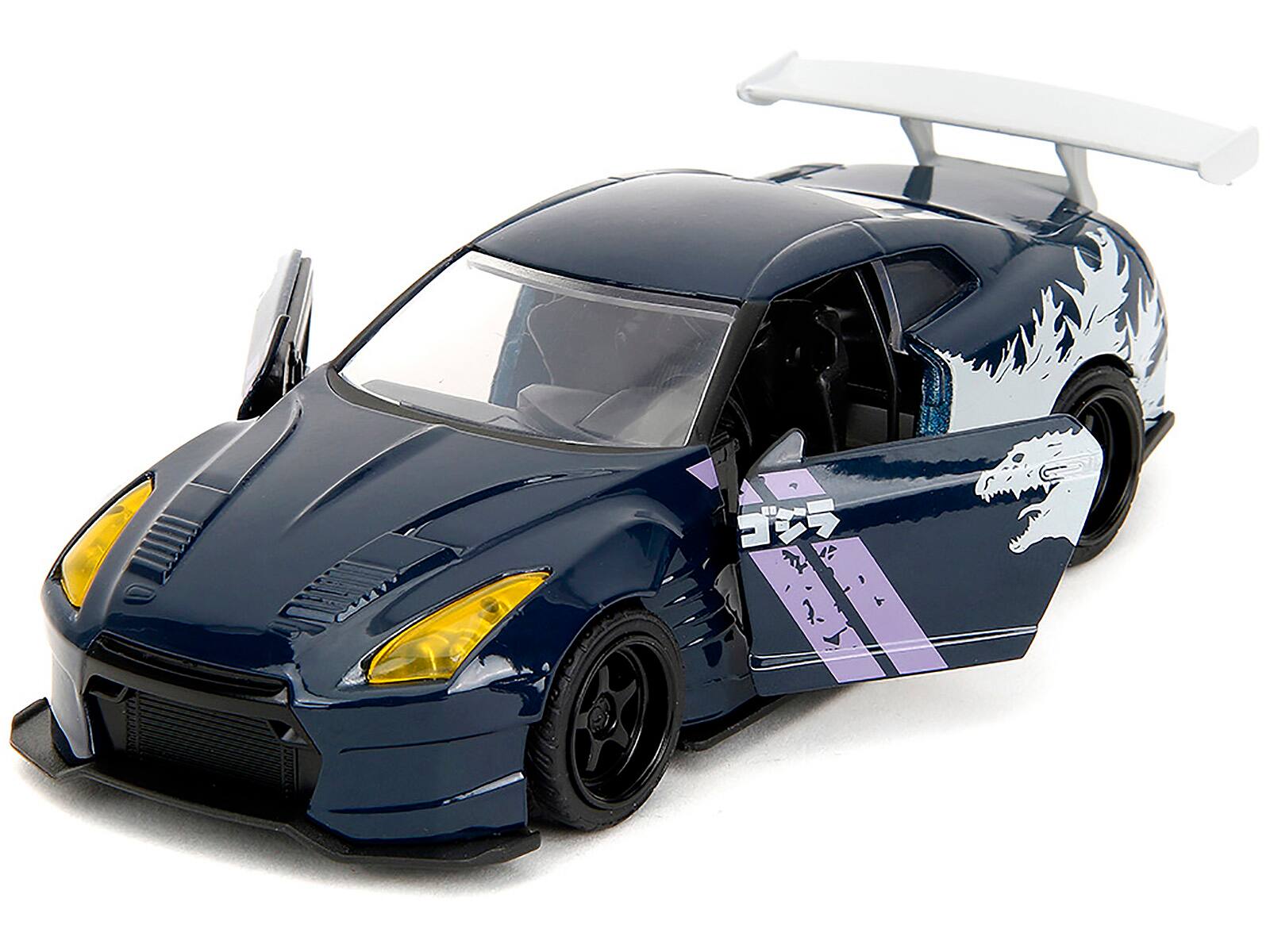 Angle. Jada - 2009 Nissan GT-R (R35) Ben Sopra Dark Blue with Graphics "Godzilla" "Hollywood Rides" Series 1/32 - Dark Blue .