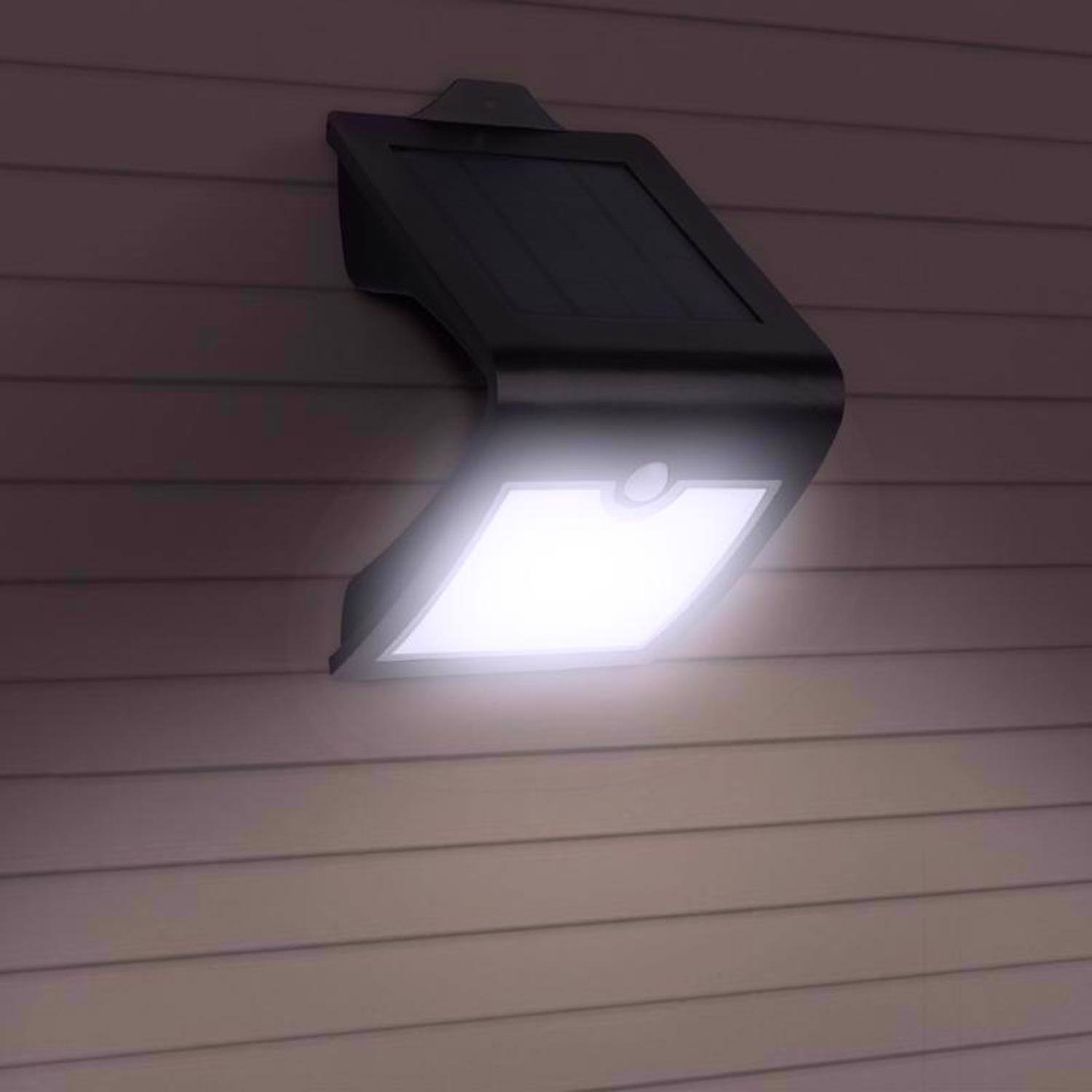 Left. FEIT ELECTRIC - Feit LED Motion-Sensing Solar Powered LED Black Security Light.
