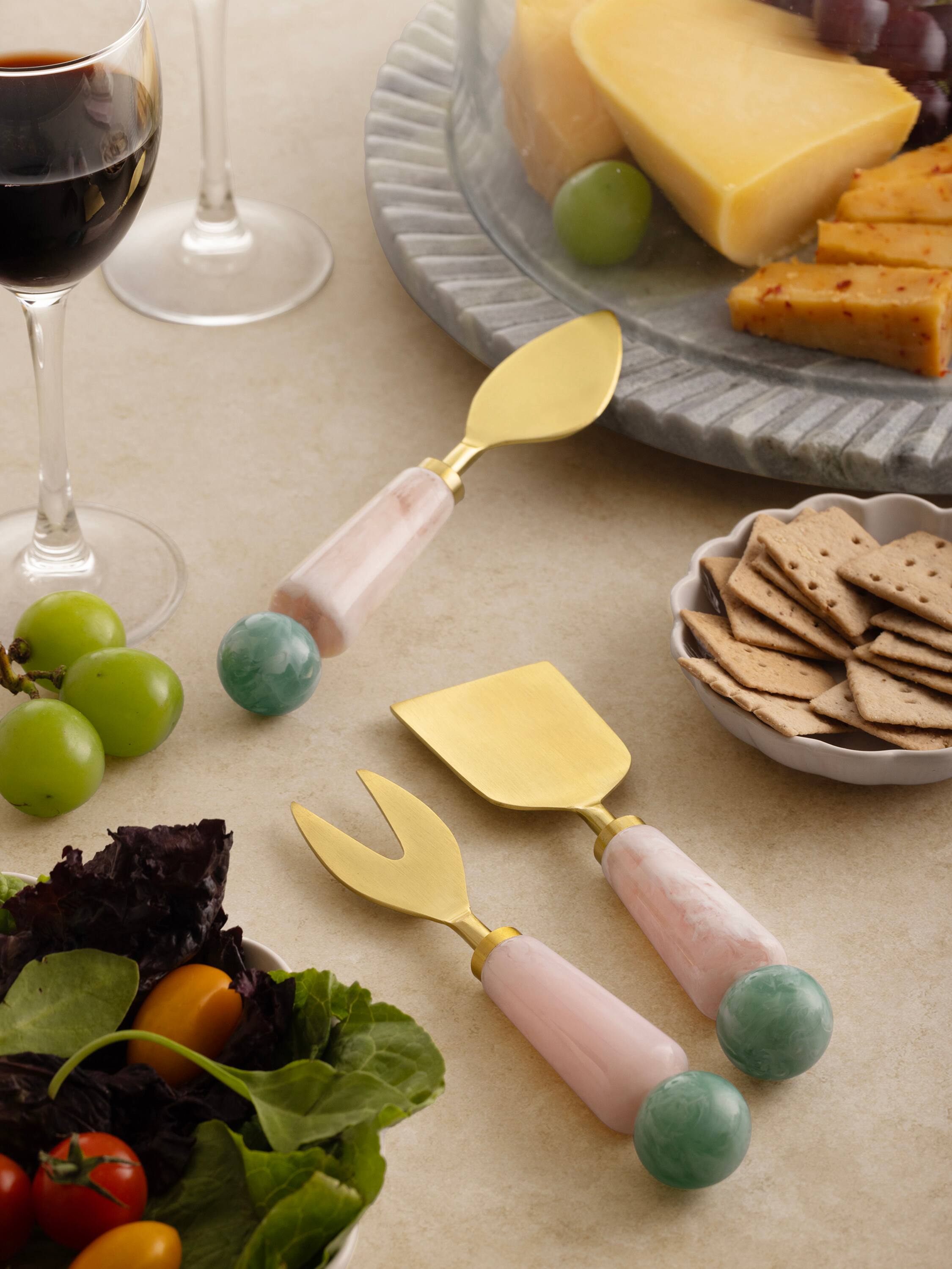 Back. GAURI KOHLI - Copenhagen Cheese Knives - Shades of pink, green and gold.