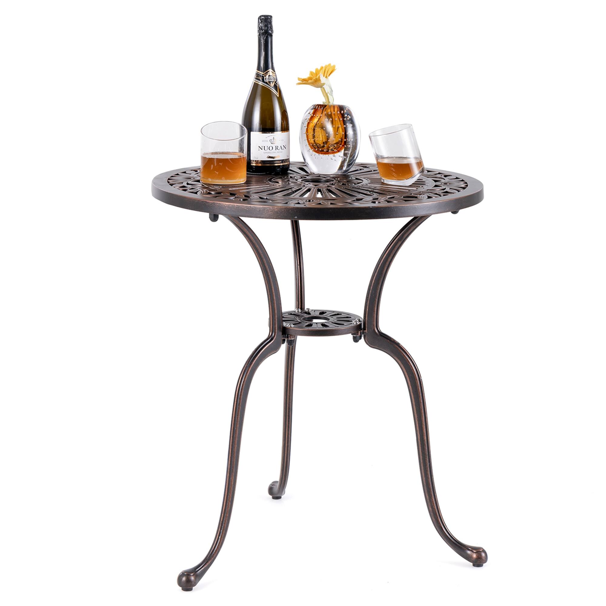 The image features a small round table with a bottle of wine and two wine glasses on it. The table is made of metal and has a black color. The wine glasses are placed on opposite sides of the table, with one glass closer to the left side and the other glass closer to the right side. The bottle of wine is positioned in the center of the table, creating an elegant and inviting setting for a wine tasting or a casual gathering.