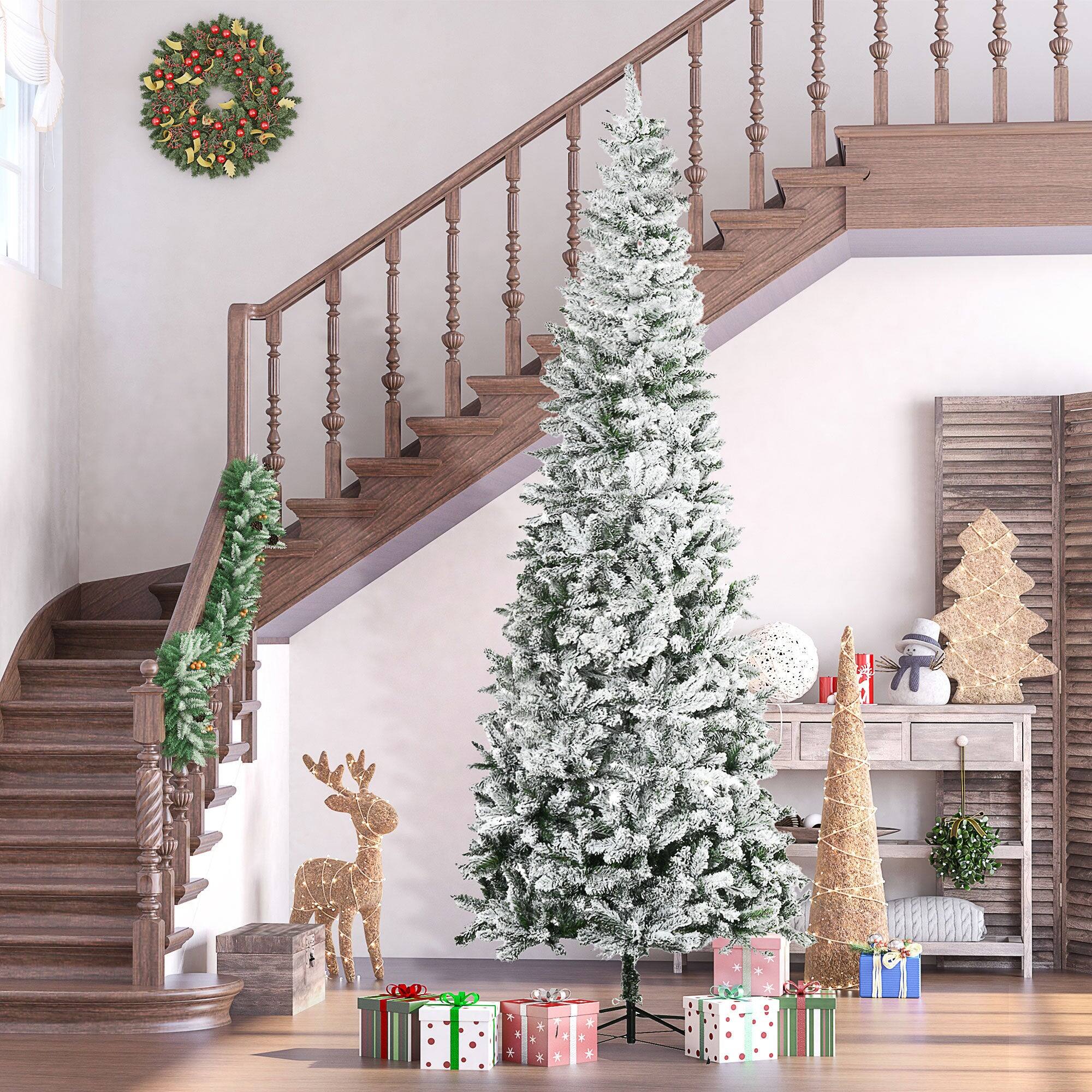 Angle. BreeBe - 9ft Unlit Snow-Flocked Slim Pine Artificial Christmas Tree with Realistic Branches and 1084 Tips - Green.