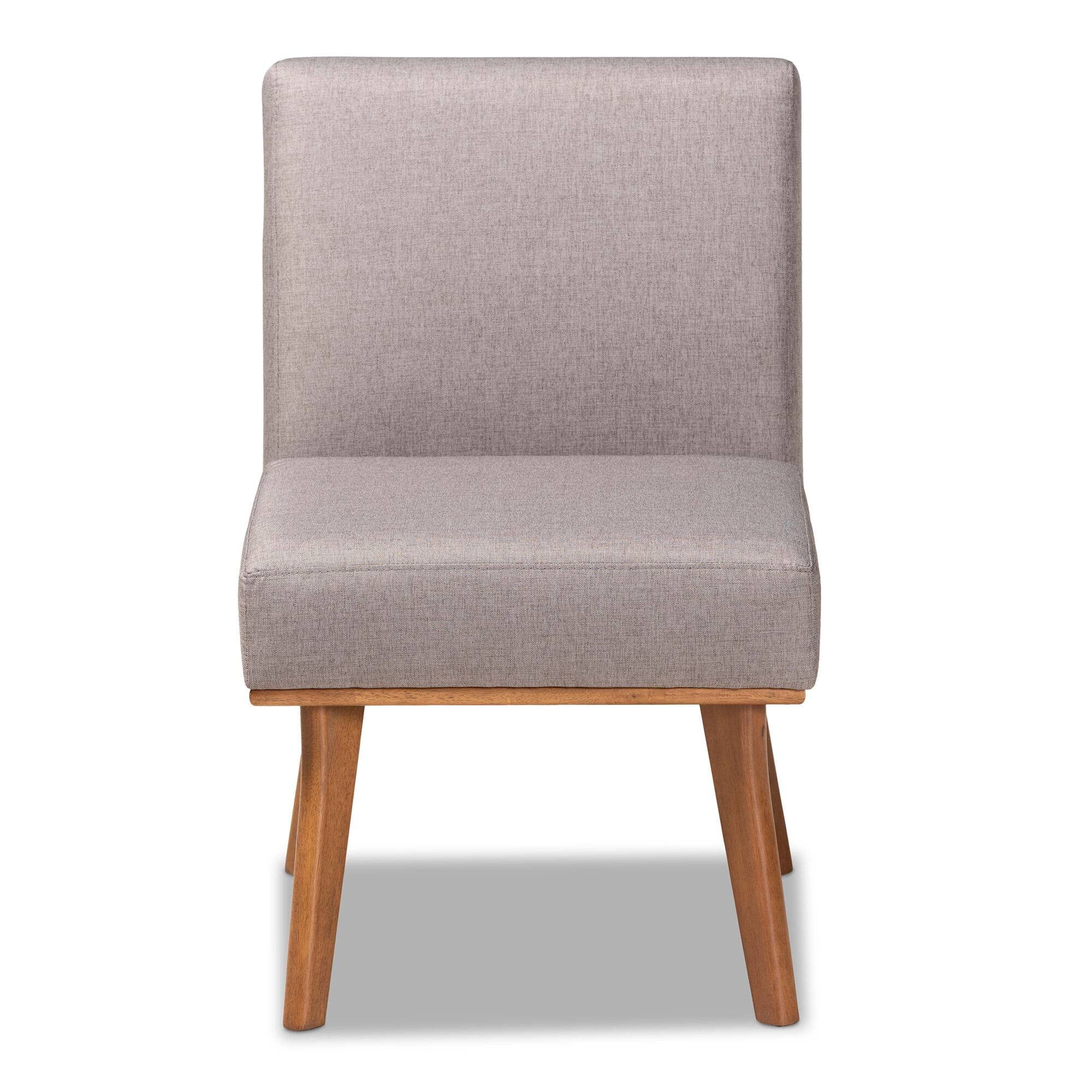 Angle. Baxton Studio - Odessa Mid-Century Modern Fabric Upholstered and Finished Wood Dining Chair - Grey/walnut brown.