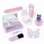 The image features a variety of makeup and beauty products, including a makeup kit, nail polish, and a bottle of perfume. The makeup kit is purple and pink, and it contains a brush and a compact. The nail polish is also pink, and there are two bottles of perfume in the scene. The overall theme of the image is focused on beauty and self-care.