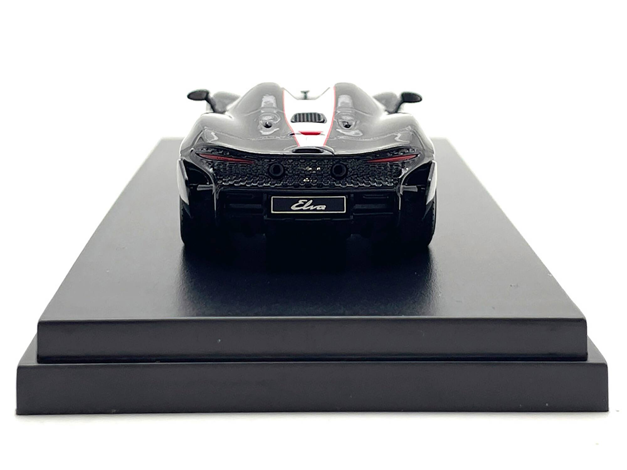 Left. LCD Models - McLaren Elva Convertible #4 Carbon Black with White and Red Stripes 1/64 Diecast Model Car by LCD Models - Carbon Black with White and Red.