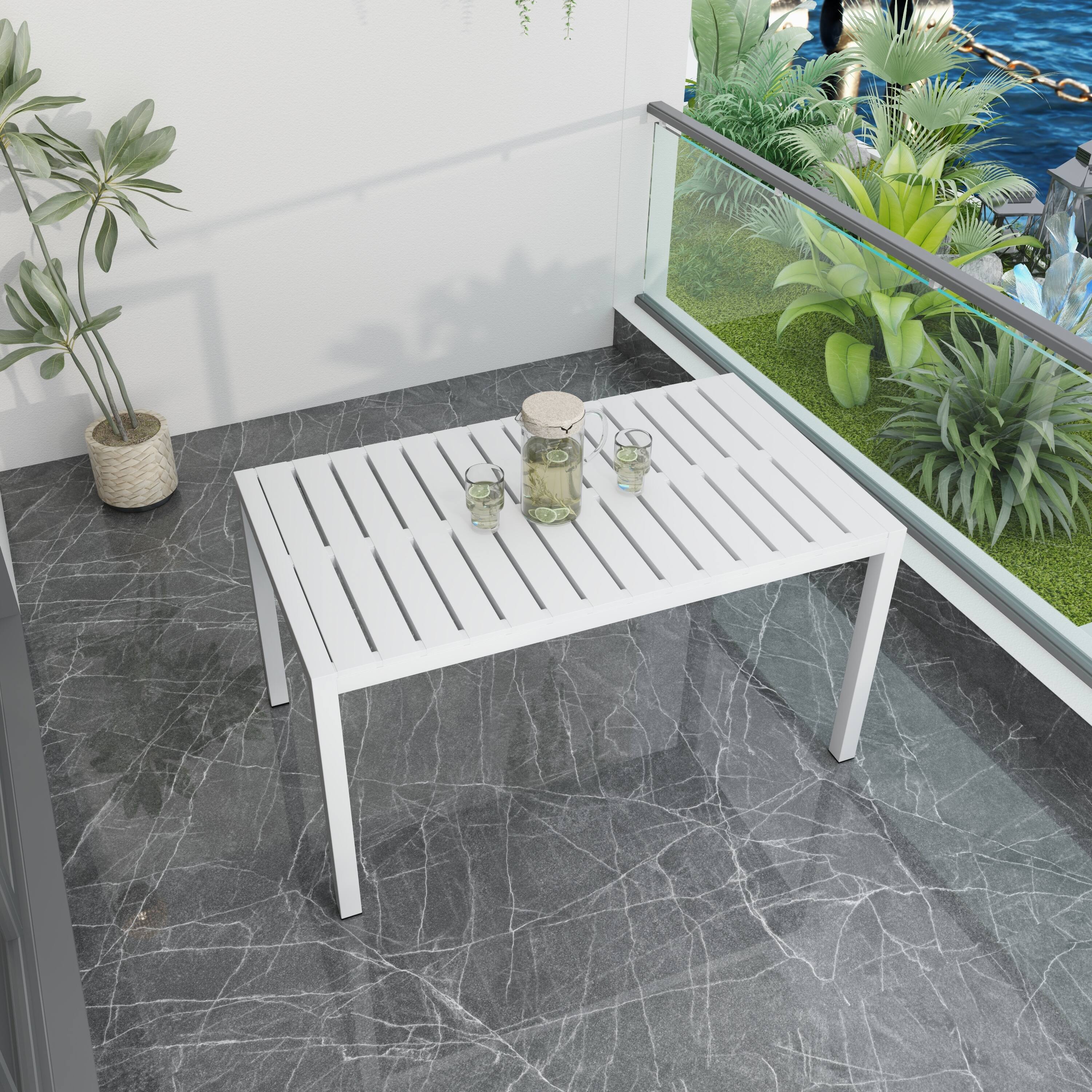 Left. Mondawe - 55 Inch Outdoor Modern Dining Table, Lightweight PP Tabletop with Metal Legs - White.