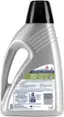 The image shows a bottle of a carpet cleaning solution, specifically designed for portable carpet cleaners. The formula is made for removing stains, such as pet stains like soy sauce, ketchup, cola, cat urine, vomit, motor oil, blood, spaghetti sauce, and coffee. The bottle is also safe for kitchen grease, red wine, and grape jelly stains. The label advises users to test the colorfastness of the solution on a small, hidden area before using it to ensure it won't affect the color of the carpet. The label also provides instructions on how to use the formula and warns users to avoid eye contact and to seek medical attention in case of irritation. The bottle is made with an earth-friendly formula and is biodegradable.