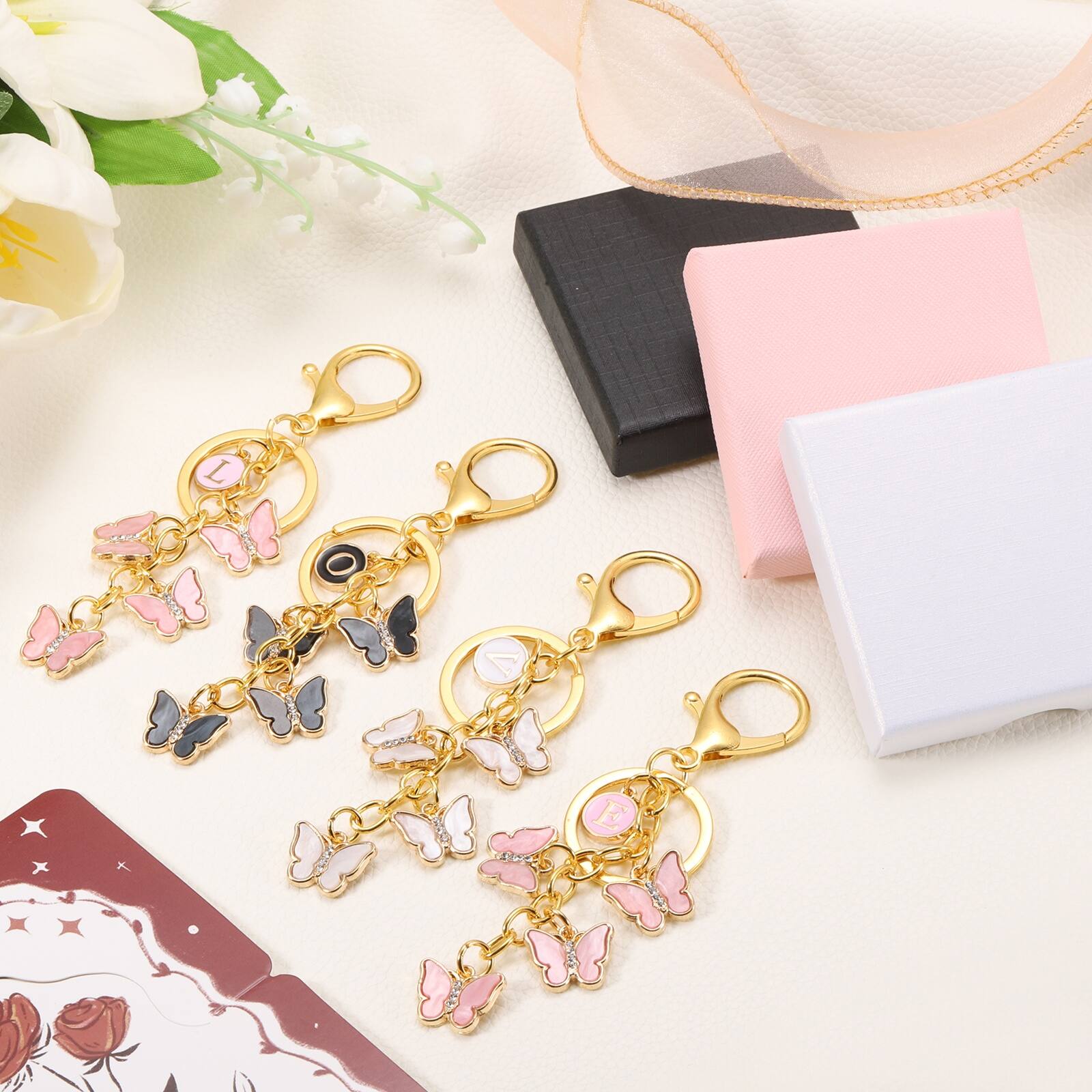 Alt View 3. Unique Bargains - Butterfly Initial Letter Keychain, Alphabet A Metal Keyring, Cute Car Keys Holder Charm for Women Gift - Pink.