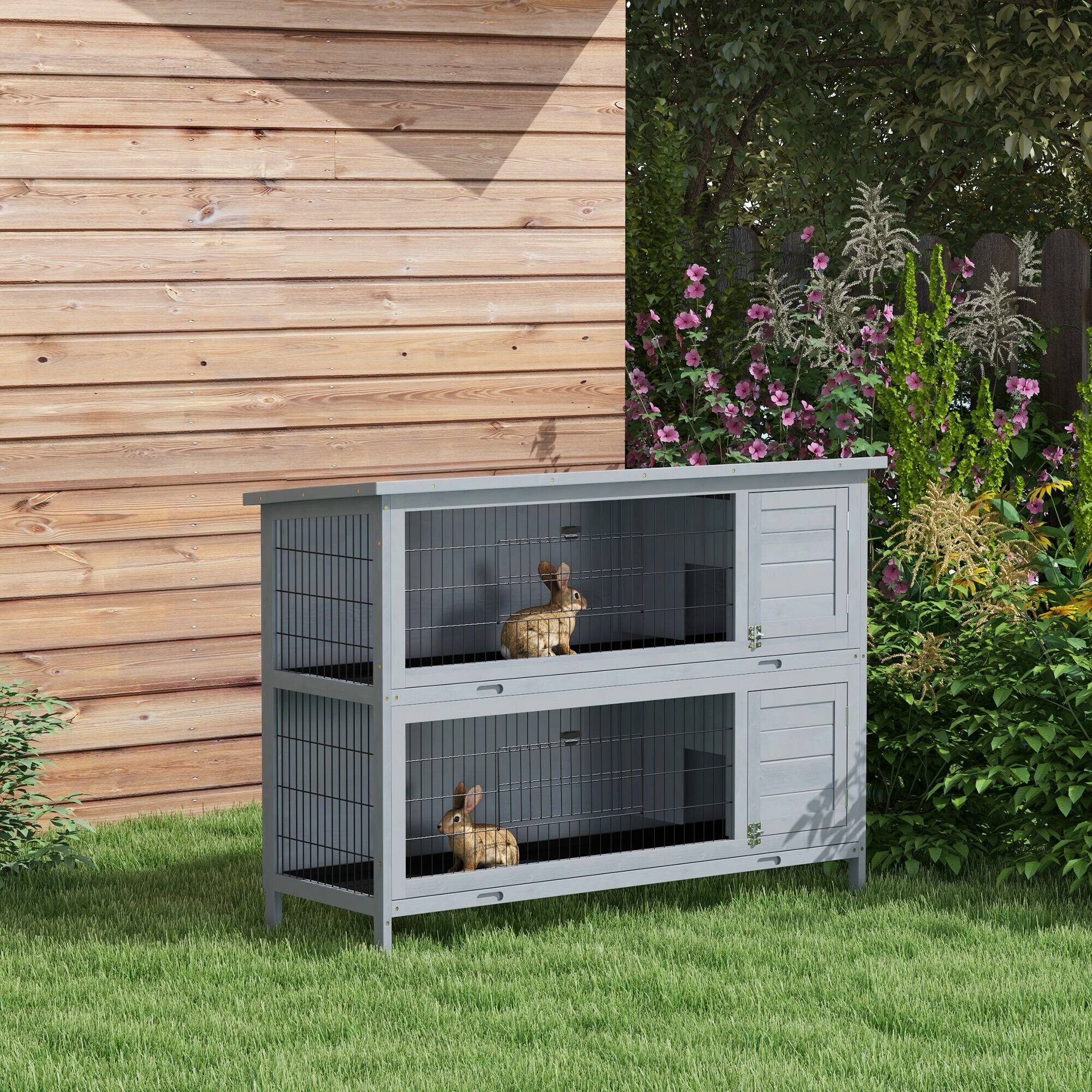 Angle. Pawhut - 54" 2-Story Wooden Rabbit Hutch, Indoor/Outdoor Small Animal Cage with Lockable Doors, No-Leak Tray & Waterproof Roof.