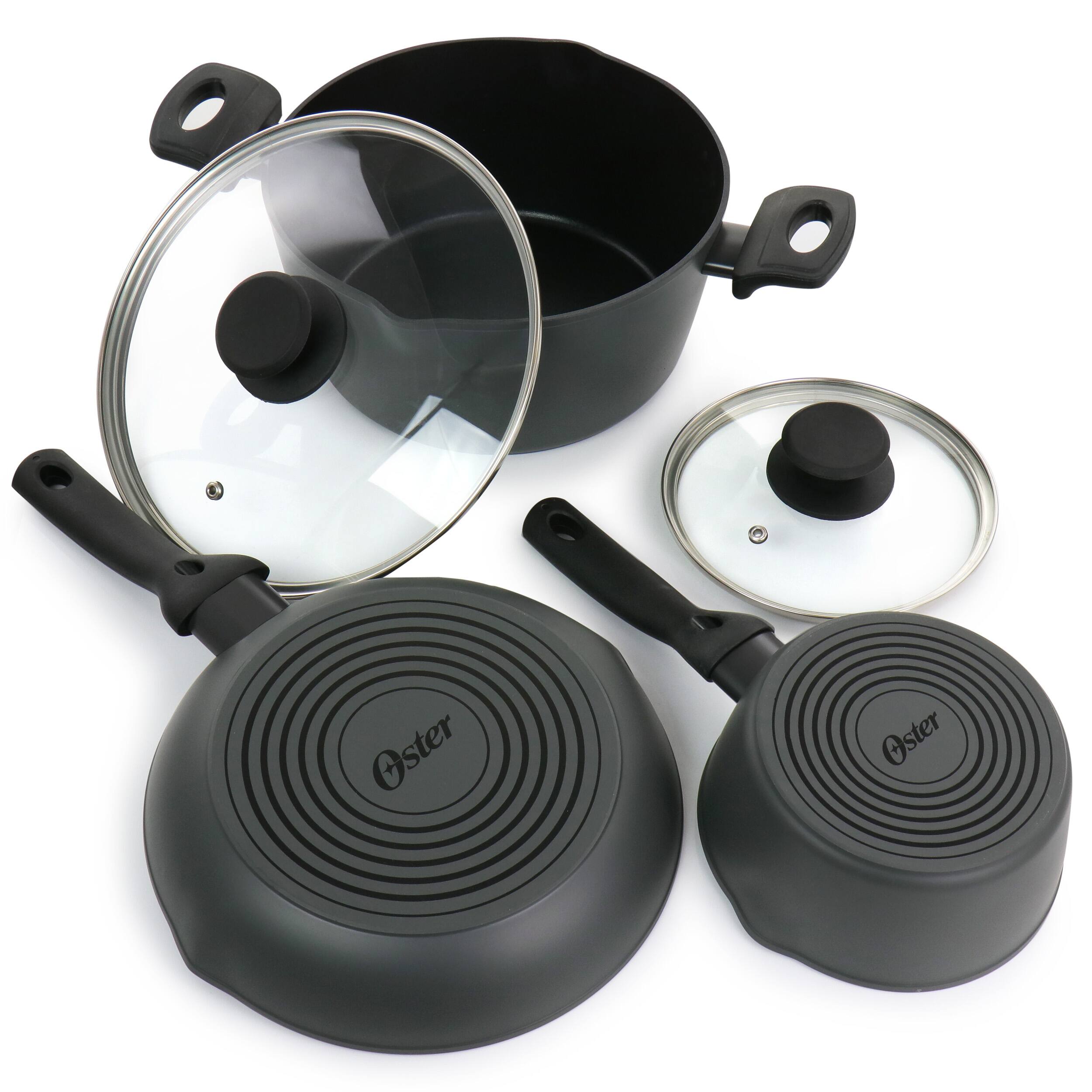 The image features a black Oster cookware set, which includes a pot, a lid, and a lid lock. The pot is placed next to the lid, while the lid lock is positioned separately. The Oster cookware set is designed for easy use and efficient cooking.