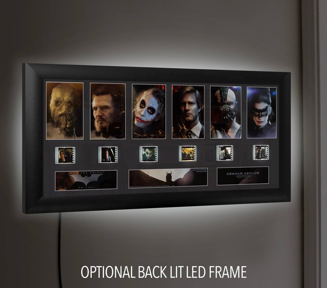 The text on the image should be grouped and corrected as follows:

- "TE AO CNIGN ARKHAM ASYLUM EDITION"
- "THE DARK KNIGHT TRILOGY"
- "ARKHAM ASYLUM EDITION"
- "OPTIONAL BACK LIT LED FRAME"