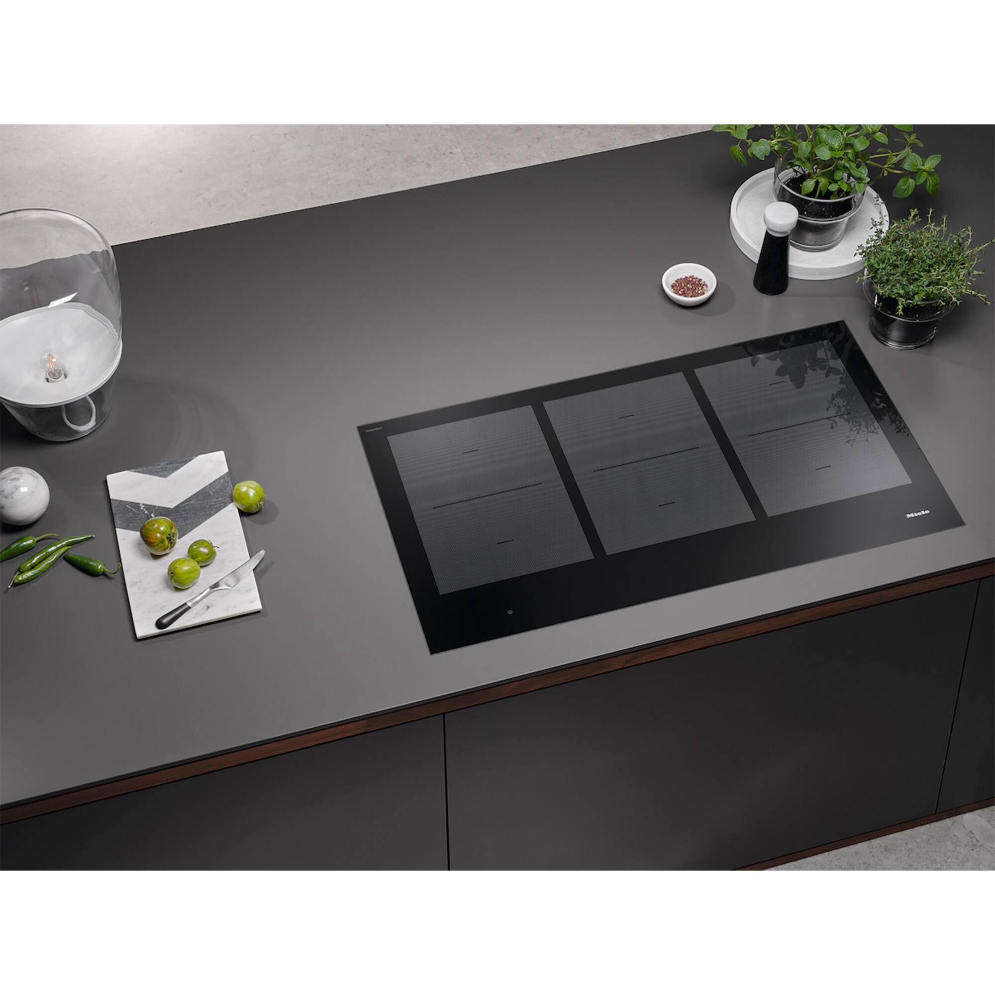 Angle. Miele - KM 7745 FL 36" Flush Mounted Induction Cooktop (Black) - Black.