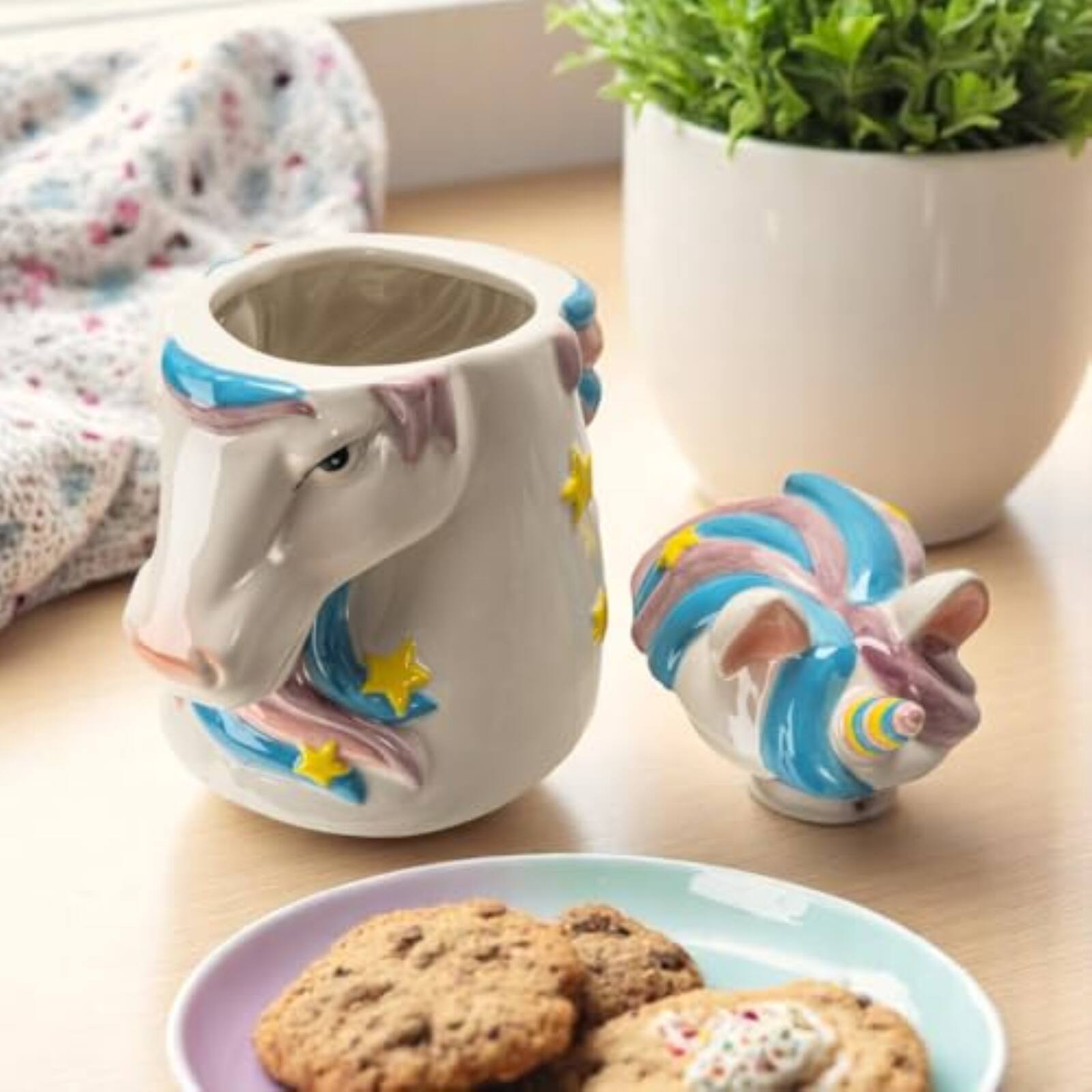 Left. Pacific Trading - Magical Unicorn Ceramic Cookie Jar, White with Pink and Blue Mane, Yellow Stars, Decorative Kitchen Storage Container - White.