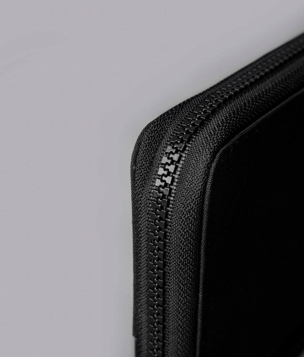 Alt View 8. ALPAKA - RFID Zip Passport Wallet with Boarding Pass Pocket, 7 Card Slots, Magnetic Flaps, Detachable Hand Strap - Black Axogrid 300D.