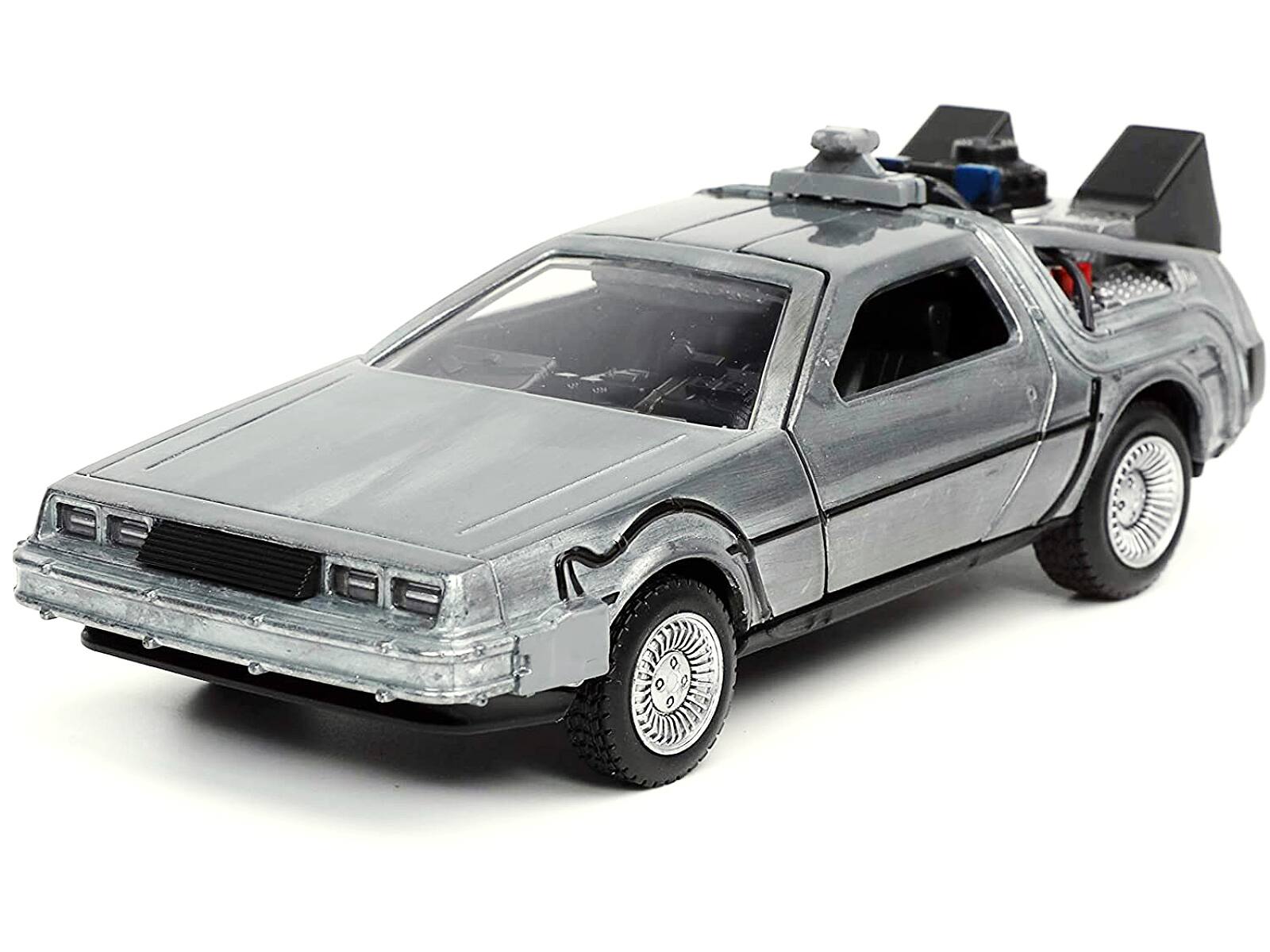 Left. Jada - DeLorean DMC (Time Machine) Brushed Metal "Back to the Future Part I" (1985) Movie "Hollywood Rides" Series 1/32 - Gray.