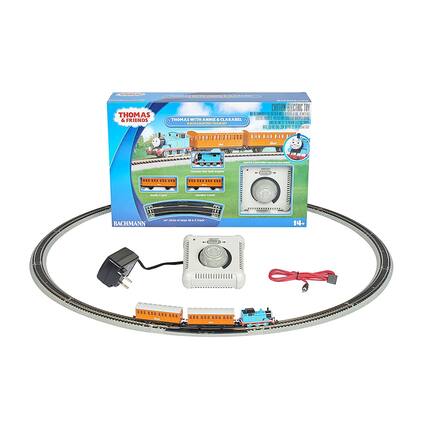 Sure, here is the corrected and grouped text from the image:
---
**THOMAS & FRIENDS**
**THOMAS WITH ANNIE & CLARABEL**
**SCALE 1:43**
**ELECTRIC TOY**
**BACHMANN**
**Speed Controller with sound**
**24" Circle of Track**
**14+**
**Thomas the Tank Engine**
**Annie Coach**
**Clarabel Coach**
**Speed Controller with sound**
**24" Circle of Track**
**14+**
**BACHMANN**
---
This text is organized based on the visible elements on the packaging and the toy set.