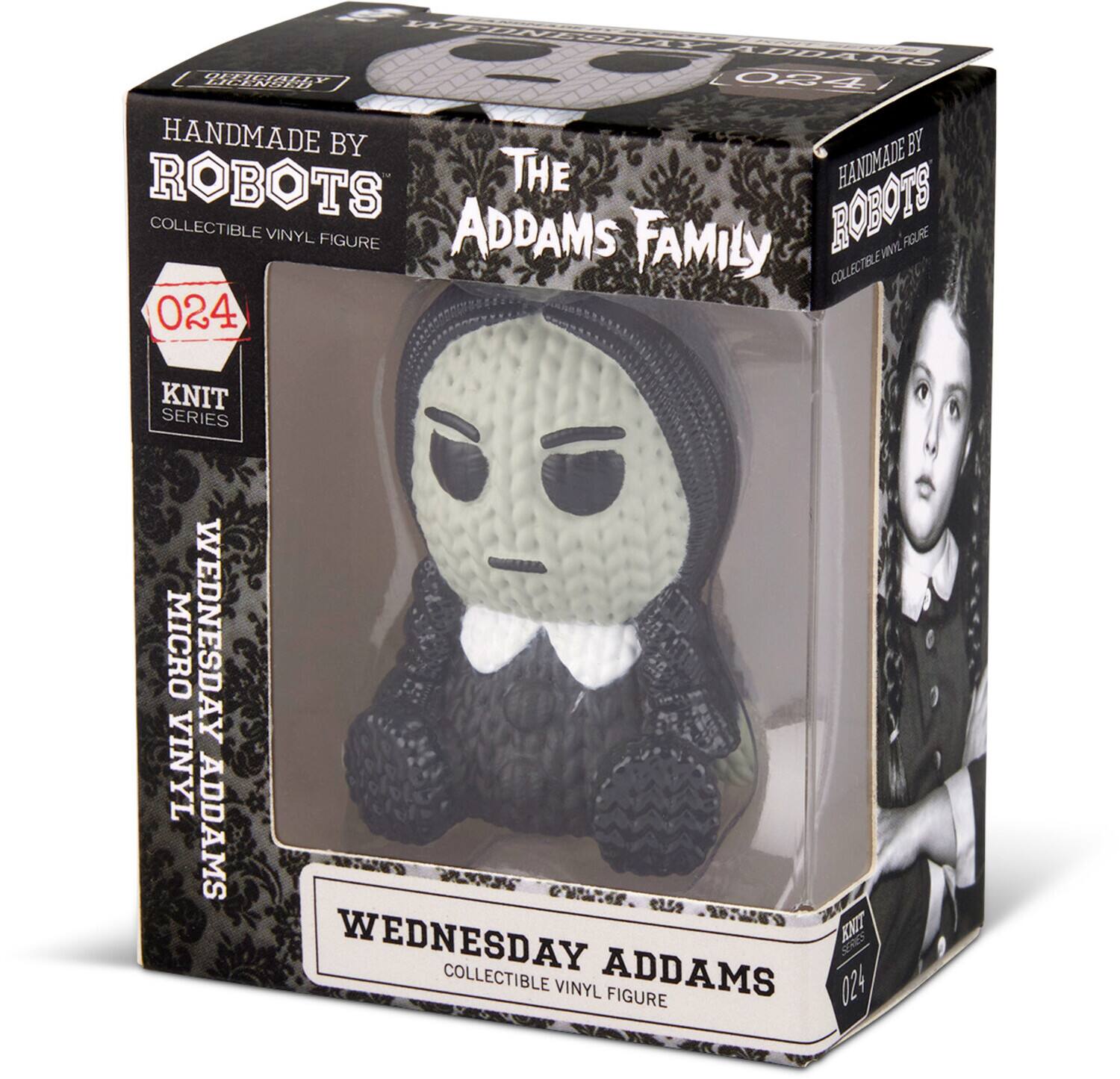 The text on the image can be grouped and corrected as follows:

"Handmade by Robots, The Addams Family, Collectible Vinyl Figure, Addams Family, Wednesday, Knit Series, Micro, Wednesday, Vinyl Figure, 024."

Corrected text:
"Handmade by Robots, The Addams Family, Collectible Vinyl Figure, Addams Family, Wednesday, Knit Series, Micro, Wednesday, Vinyl Figure, 024."