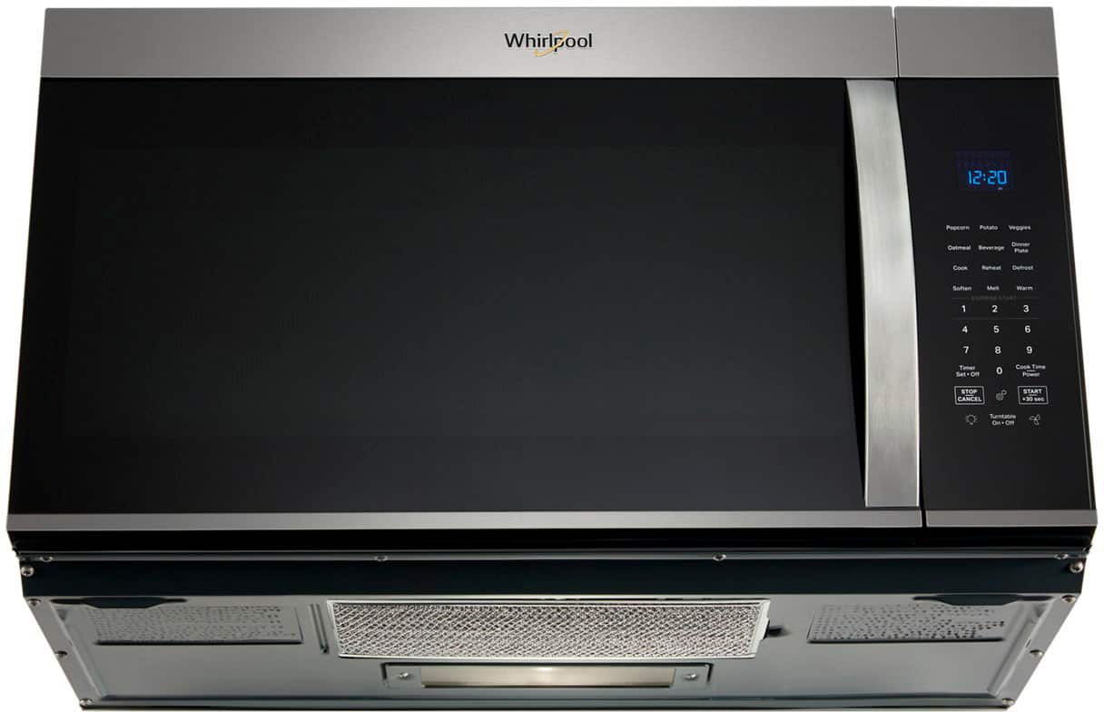 Whirlpool oven with a timer set on 0. The oven has a turntable and a defrost setting. The buttons on the oven include a cock, reheat, defrost, soften, warm, and cancel. The oven is currently empty.