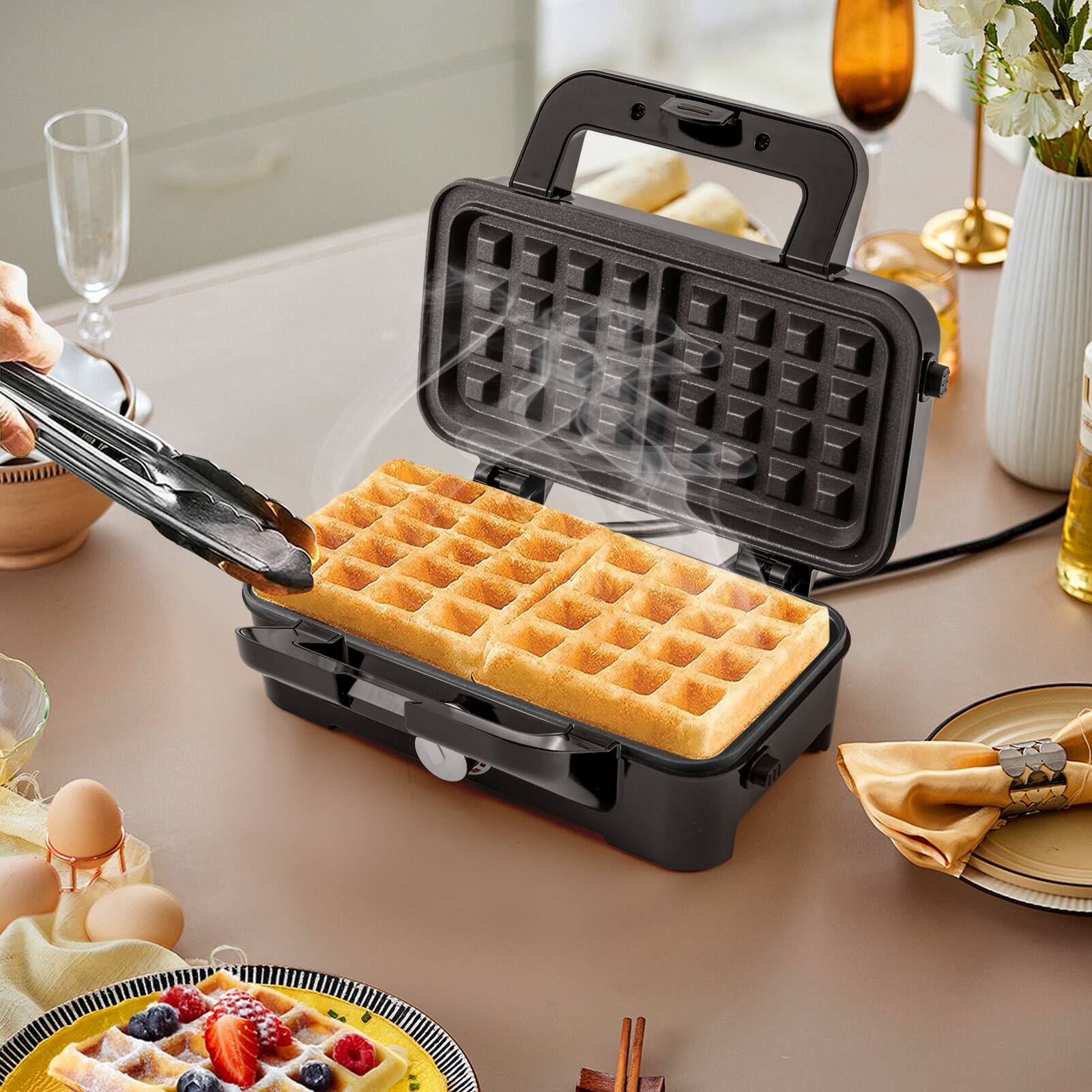 Angle. SKONYON - Compact Waffle Maker with Nonstick Plates Even Heating and Foldable Storage Design - Black.