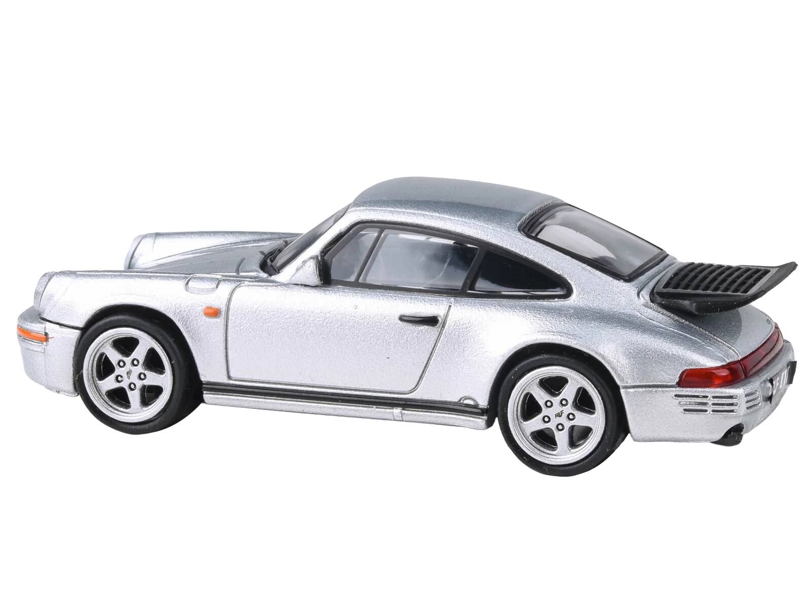 Left. Paragon - 1987 RUF CTR Yellowbird Silver Metallic 1/64 Diecast Model Car by Paragon Models - Silver Metallic.