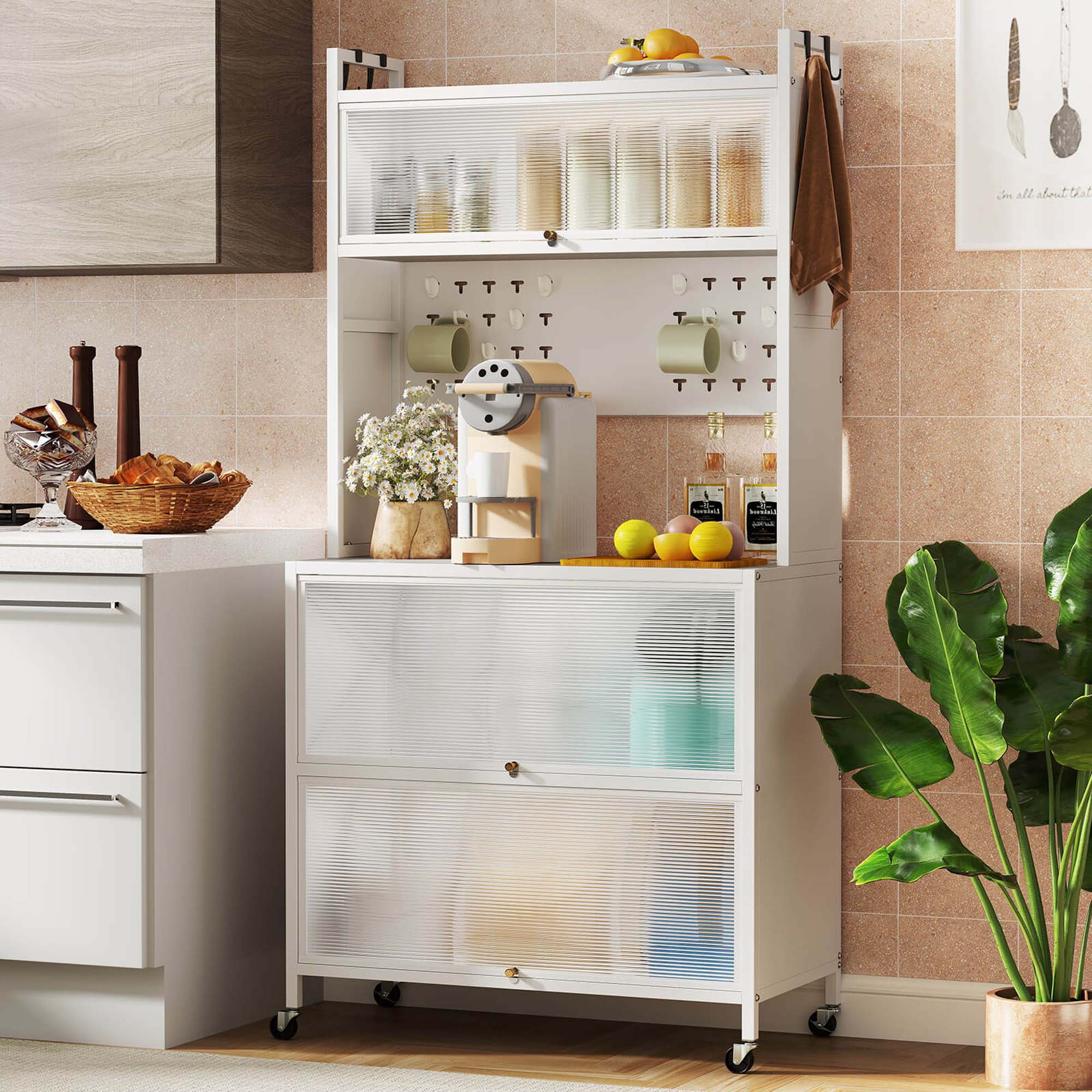 The image shows a kitchen with a white countertop and a white shelf with various items on it. There are several bottles, including a bottle of wine, placed on the shelf. Additionally, there are oranges and a bowl of bread on the countertop. A potted plant is also present in the scene, adding a touch of greenery to the kitchen. The overall setting appears to be a well-organized and functional space for cooking and food preparation.