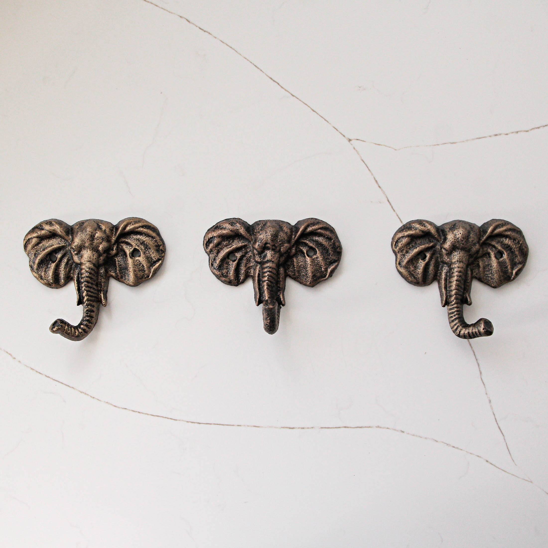 Alt View 1. Zeckos - 4 Inch Cast Iron Elephant Antique Gold Decorative Wall Hooks Coat Towel Set of 3 - Gold.