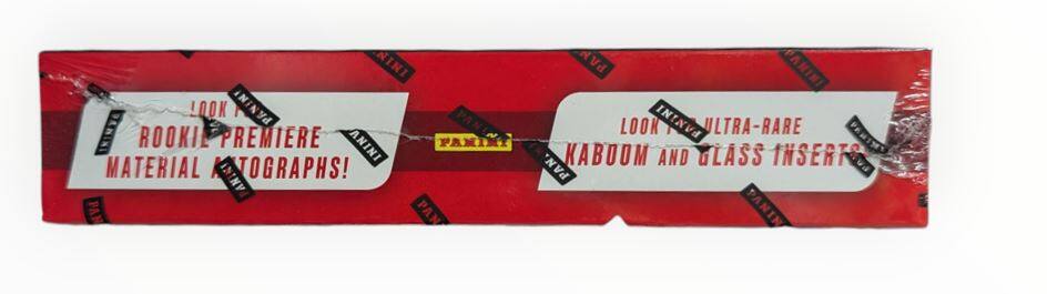 Sure, here is the corrected and grouped text from the image:

---

**PANINI**

**ROOKIE PREMIERE AUTOGRAPH MATERIALS!**

**LOOK FOR ULTRA-RARE KABOOM AND GLASS INSERTS!**

**PANINI**

---

This text is from a Panini product, likely a trading card pack or box, highlighting the inclusion of rookie premiere autograph materials and ultra-rare inserts.