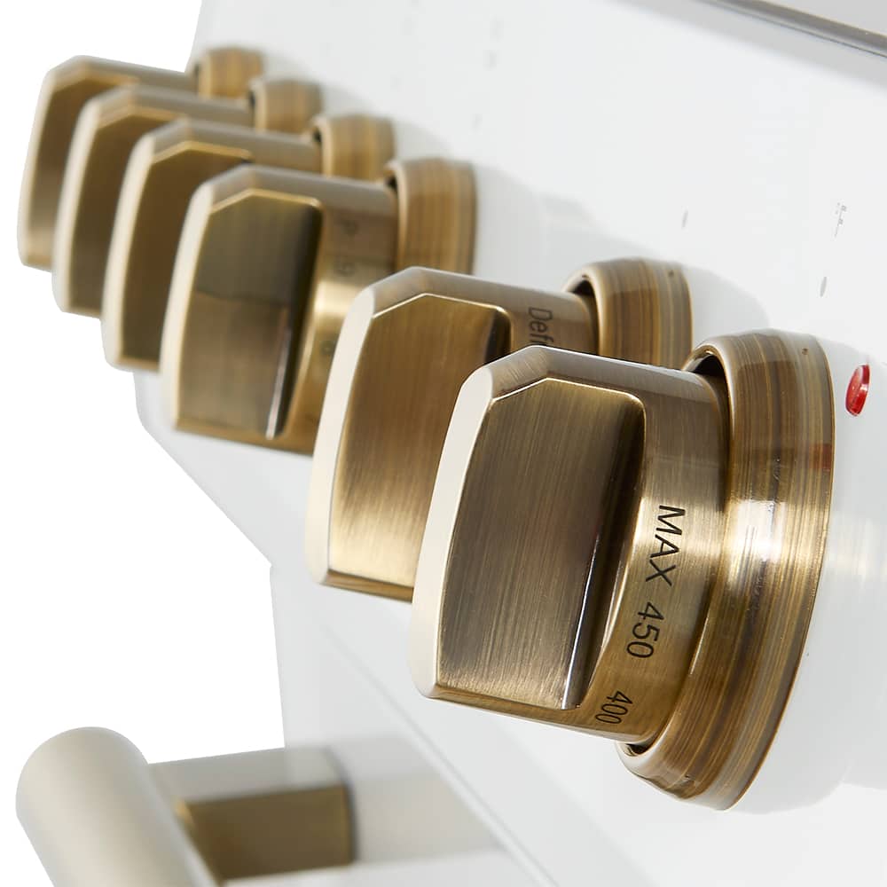 The text on the image reads "Def MAX 450 400." This suggests that the device is a stove or oven with a maximum temperature setting of 450 degrees. The knobs are gold, and there are five of them, indicating that the device has multiple temperature settings or functions.