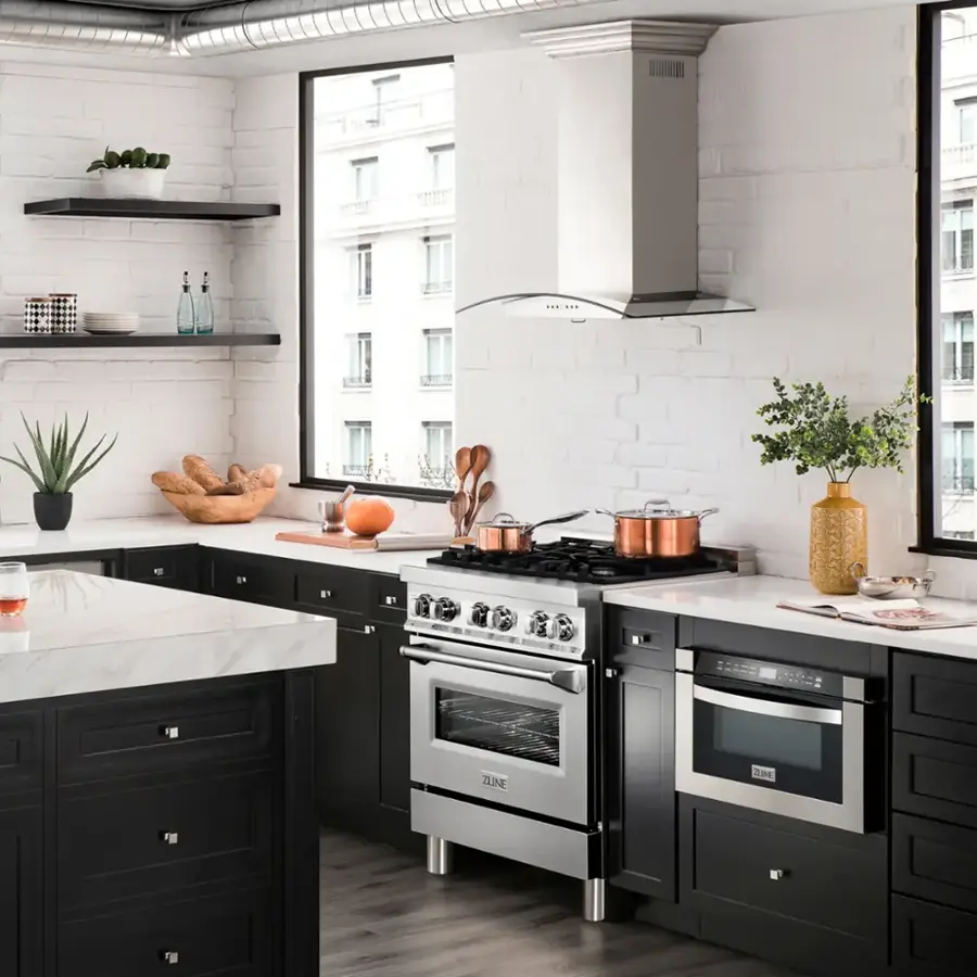 The text on the image reads "S2=E tn_toturnie ZUNE." However, it is not clear what this text is referring to or its significance. It does not seem to be related to the content of the image, which features a kitchen with a stove, oven, and other appliances.