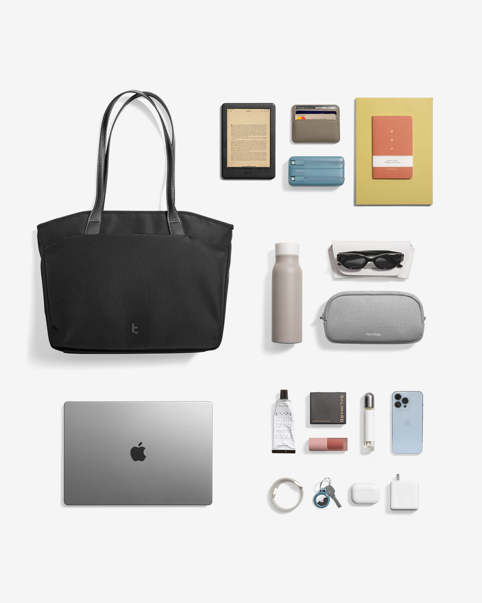 The image shows a variety of items, including a laptop, a handbag, a book, a cell phone, a bottle, a mouse, a remote, and a pair of sunglasses. These items are arranged in a grid, with the laptop and handbag placed in the top left corner, the book in the top right corner, the cell phone in the middle right, the bottle in the middle left, the mouse in the bottom left, the remote in the bottom right, and the sunglasses in the bottom center.