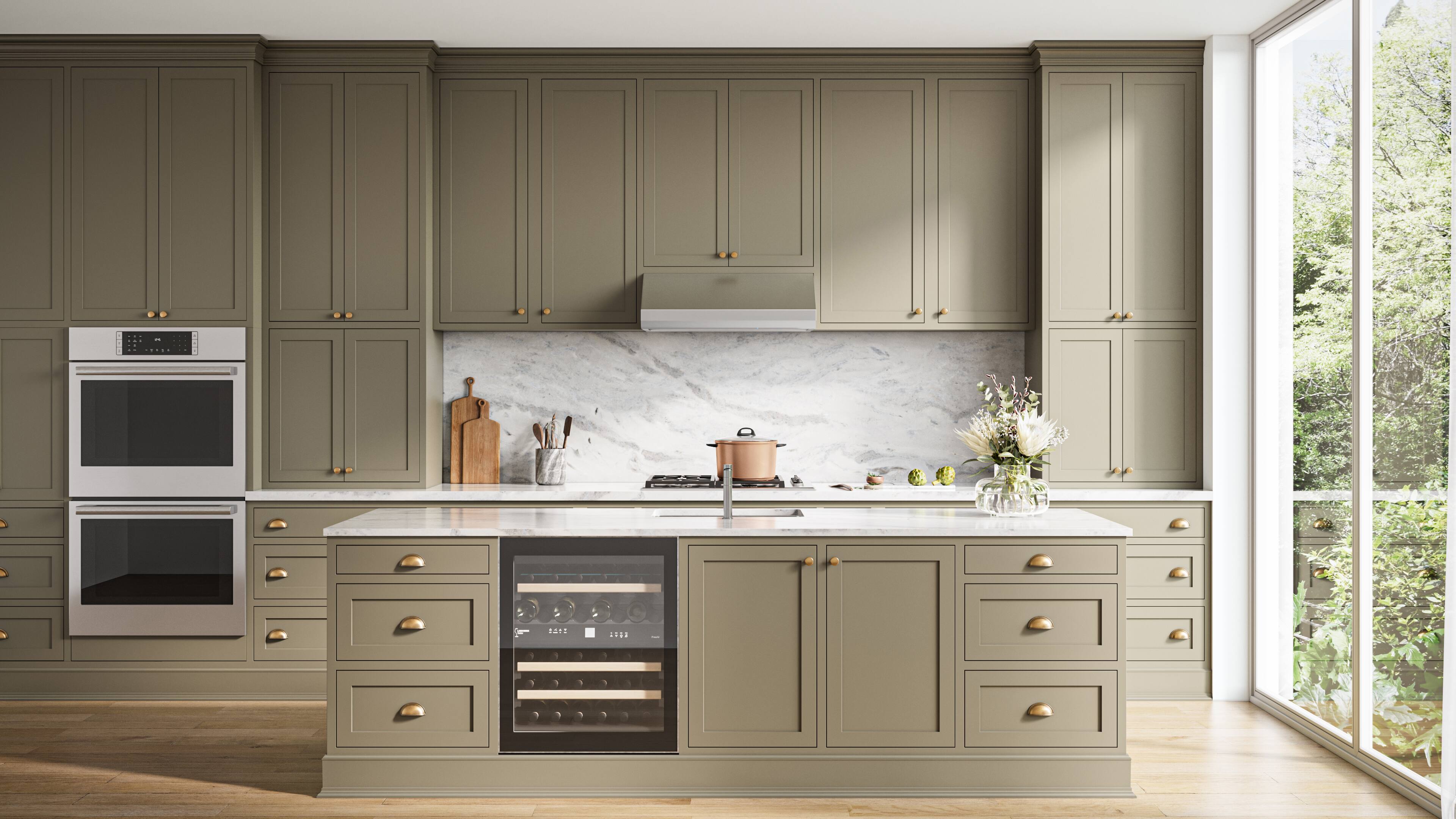 The image shows a large kitchen with a center island and a window above it. The kitchen is equipped with a stove, oven, and sink, and features a variety of cabinets and drawers. There are several items on the countertop, including a vase, a knife, a spoon, and a bottle. The kitchen also has a potted plant and a bowl, adding to the overall ambiance of the space.
