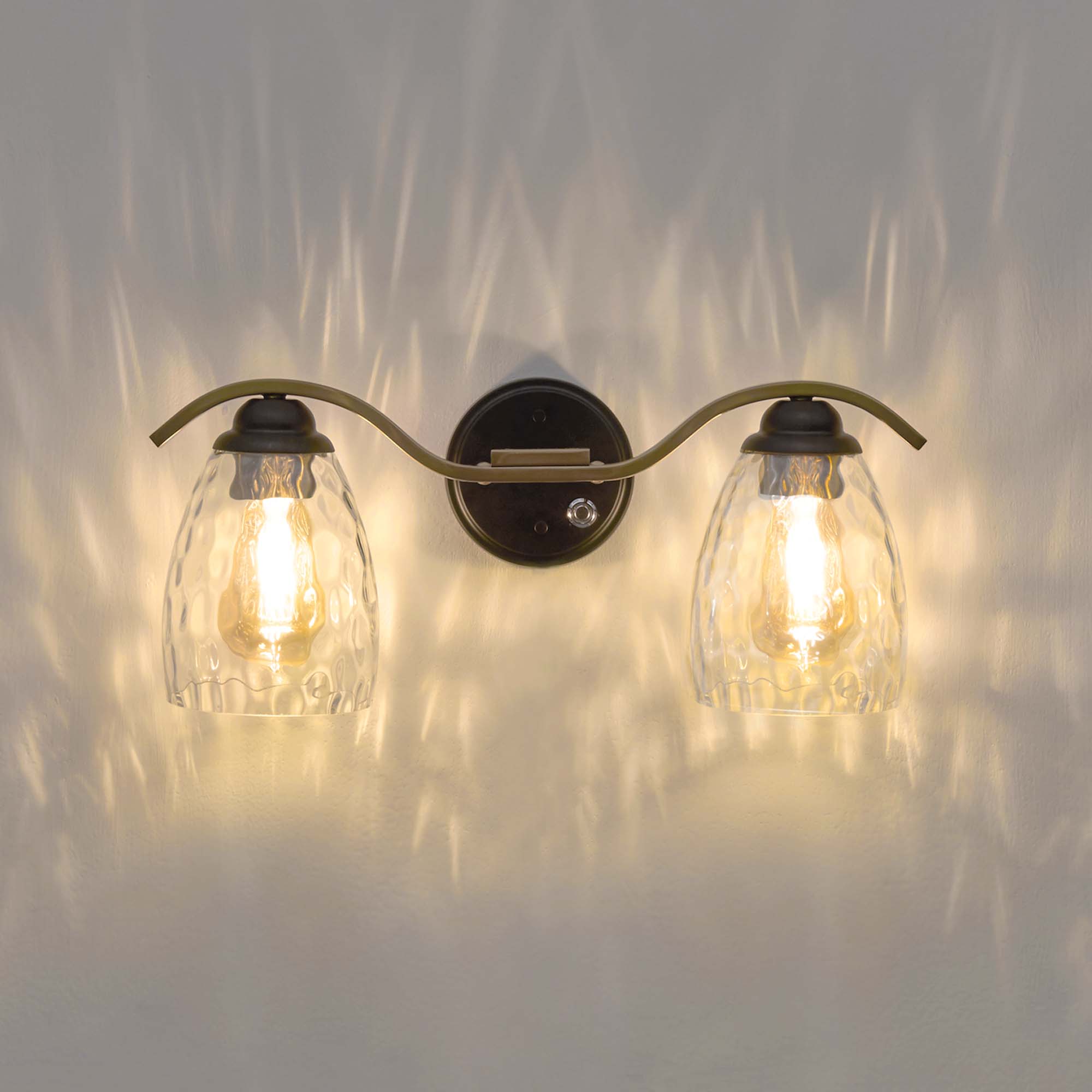 Front. Teamson Home - Heidi 2-Light Touch Dimmer Bathroom Sconce, Clear Hammered Glass Cloche Shades, Black/Brass.
