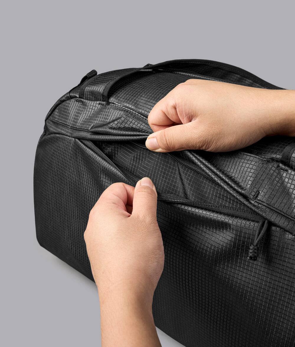 Alt View 7. ALPAKA - 35L Lightweight Duffel Bag for Gym, Weekend Trips & Carry-On Travel, Momentum Duffel, Weather-Resistant - Axodyne hybrid Black.