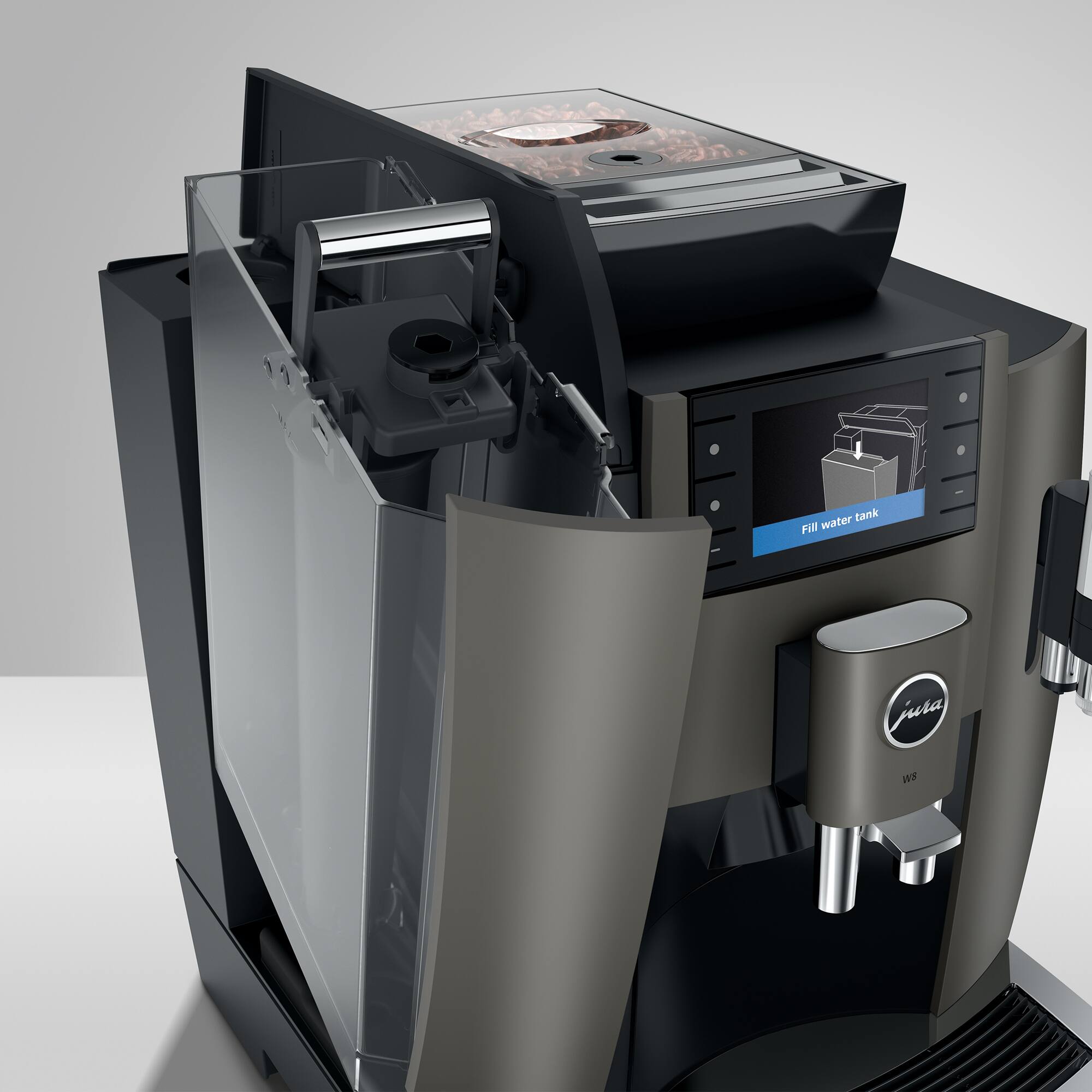 The image features a modern coffee machine with a water tank labeled "Jura 19." The machine is open, revealing its internal components, including a coffee grinder. The coffee maker is designed to make coffee and espresso drinks, and it is likely a high-quality, professional-grade appliance.