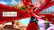 Carmen Sandiego is a character from the popular video game series. The image shows her in a red coat and hat, running through a city. The text on the image reads "Carmen Sandiego," which is the name of the character.