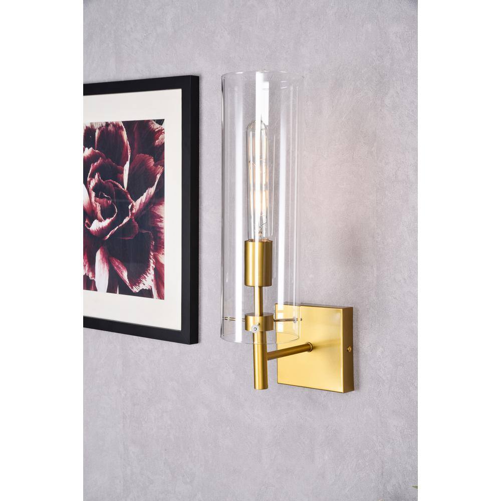 Left. Living District - Savant 1 light brass wall sconce - Brass And Clear.