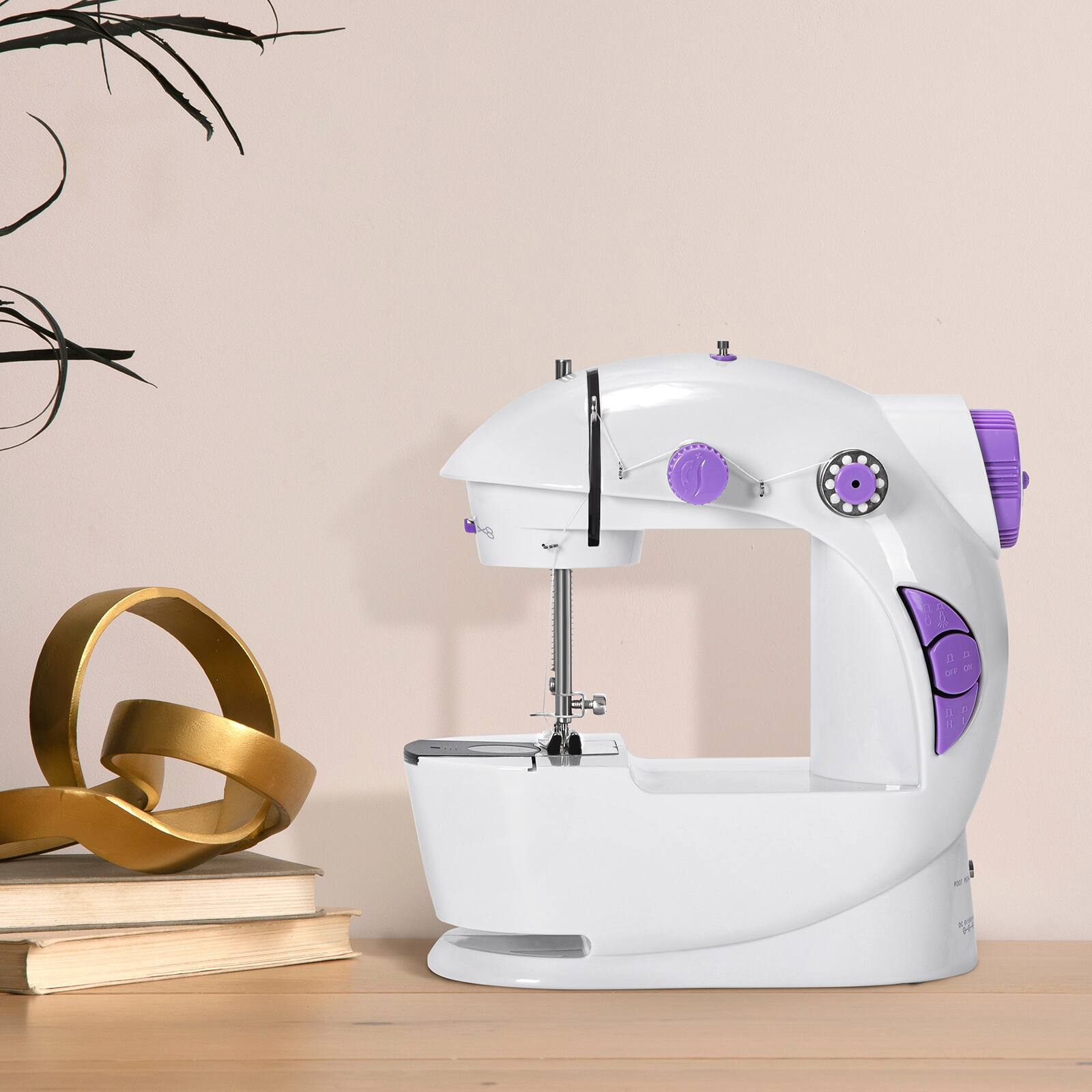 Angle. Oumilen - Mini Portable Sewing Machine with Dual Speed Control.