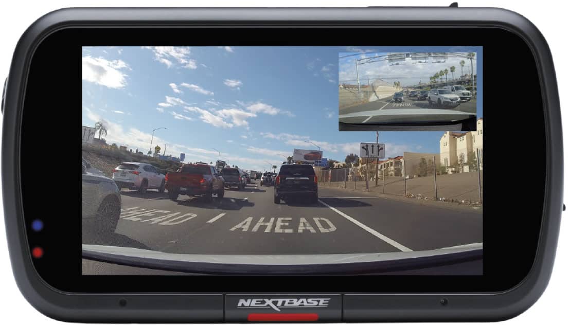 The text on the image can be grouped and corrected as follows:
- "AHEAD NEXTBASE"
- "NEXTBASE" (on the device)
The text on the road reads:
- "AHEAD"