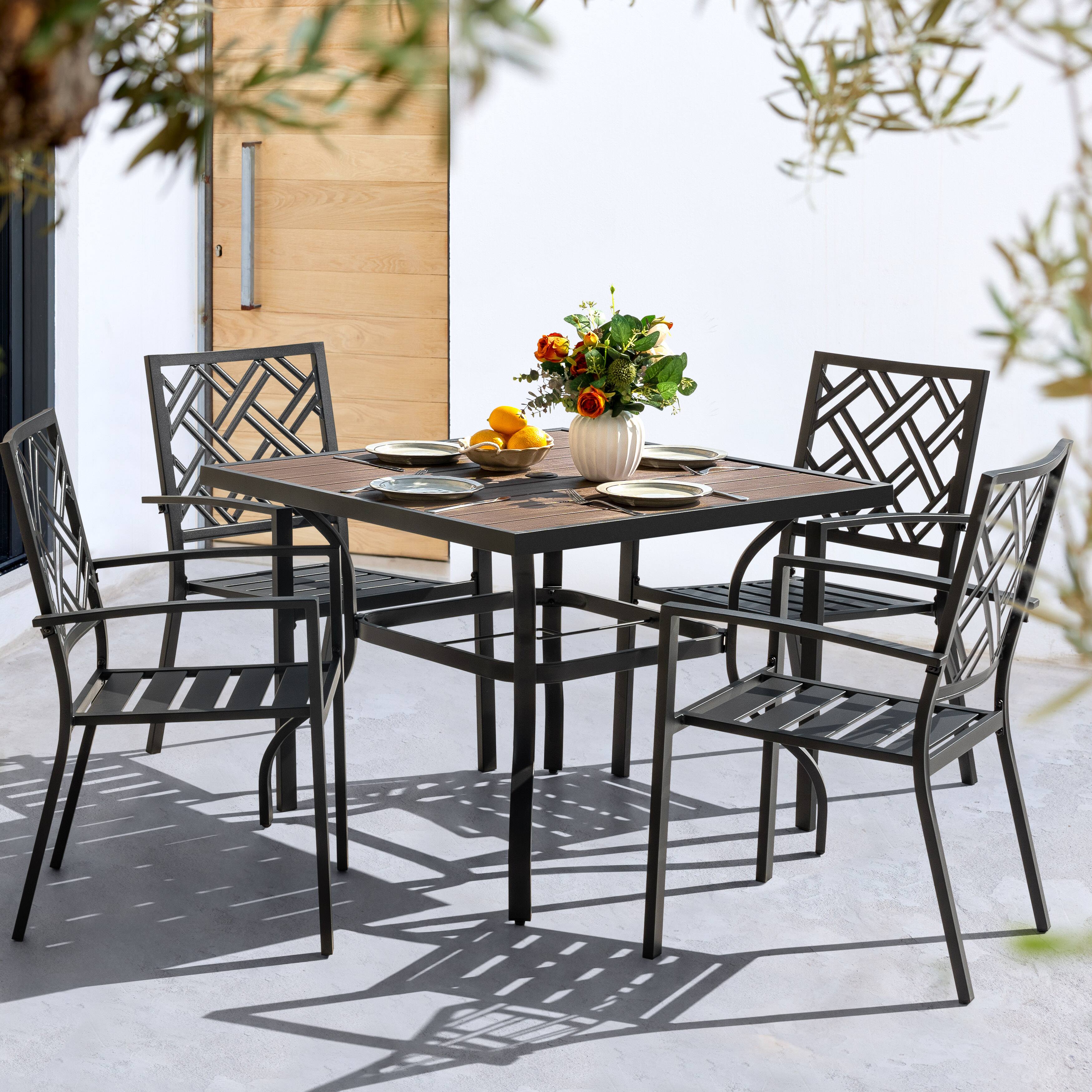 Angle. Nuu Garden - 5PCS Patio Dining Set with Umbrella Hole, Faux Wood Top, Stackable Design - Black and Brown.