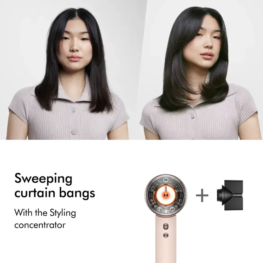 Sweeping curtain bangs with the styling concentrator.