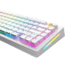 The text on the image is a description of a keyboard with a rainbow theme. The keys are colorful, and the keyboard is white. The keys include letters, numbers, and symbols, such as the arrow keys and function keys. The keyboard is designed to be visually appealing and easy to use.