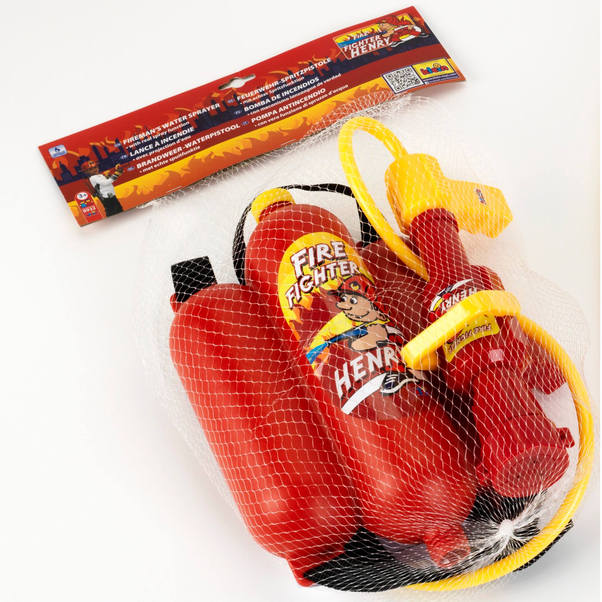 The image features a red fire extinguisher, which is also known as a fireman's water pistol. The fire extinguisher is placed inside a plastic bag, and there is a yellow strap attached to it. The fire extinguisher is designed to be used by firefighters to extinguish fires and is a versatile tool that can be used in various situations. The image also includes a booklet, which may provide information about the proper use and maintenance of the fire extinguisher.